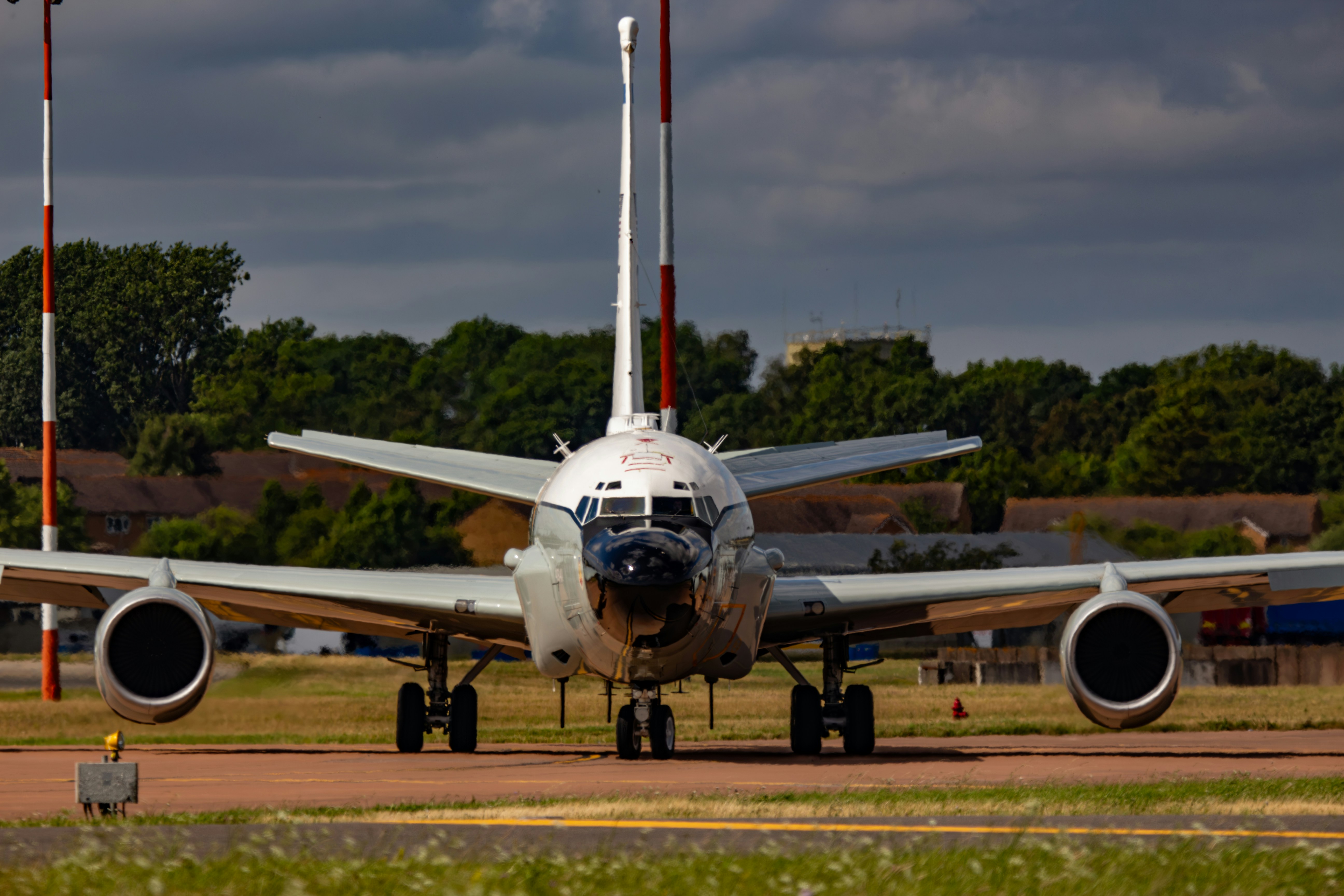 A large jetliner sitting on top of an airport runway, 