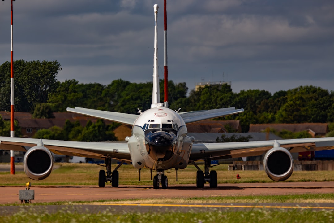 A large jetliner sitting on top of an airport runway,