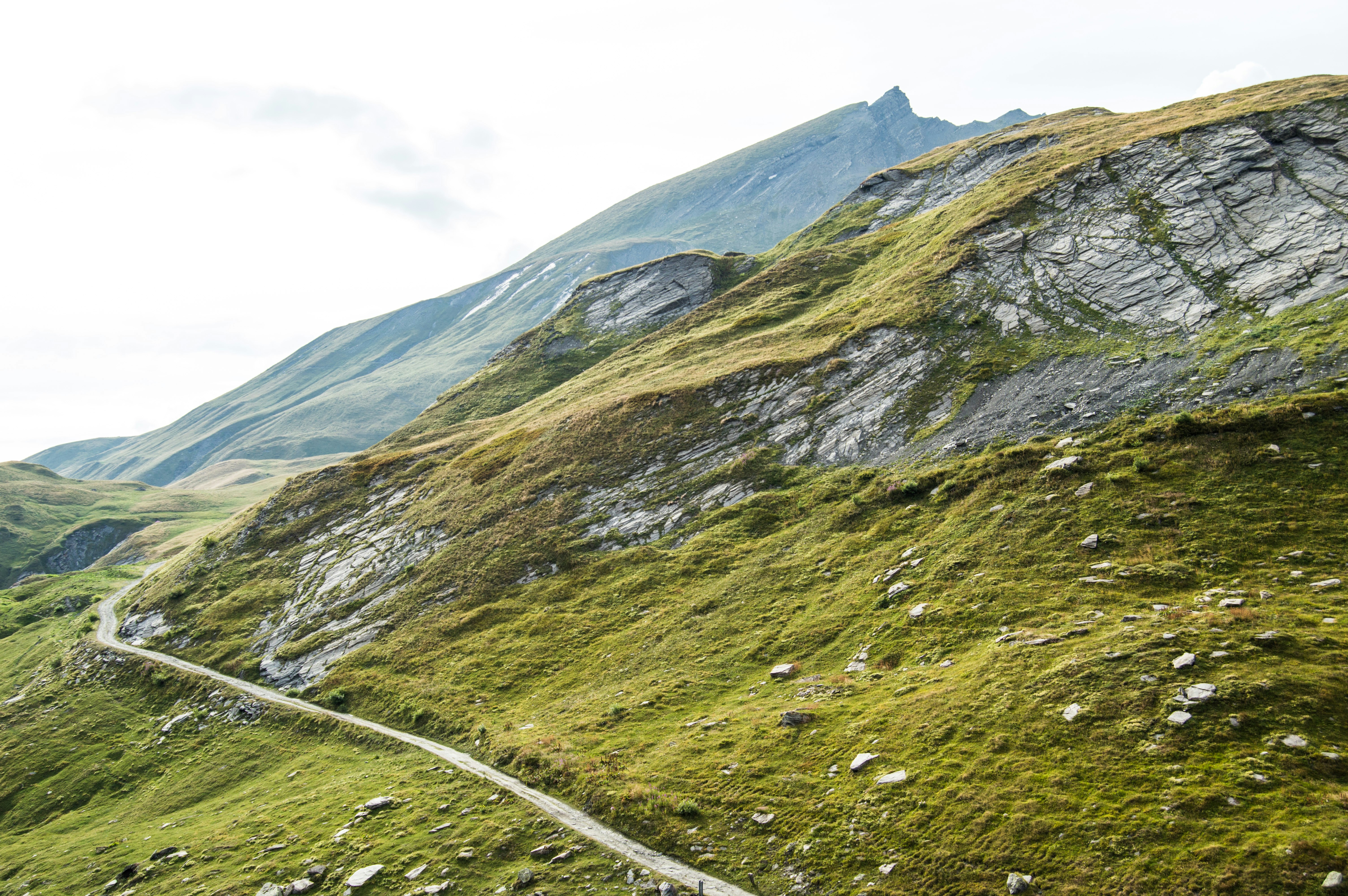 A winding road in the middle of a mountain range