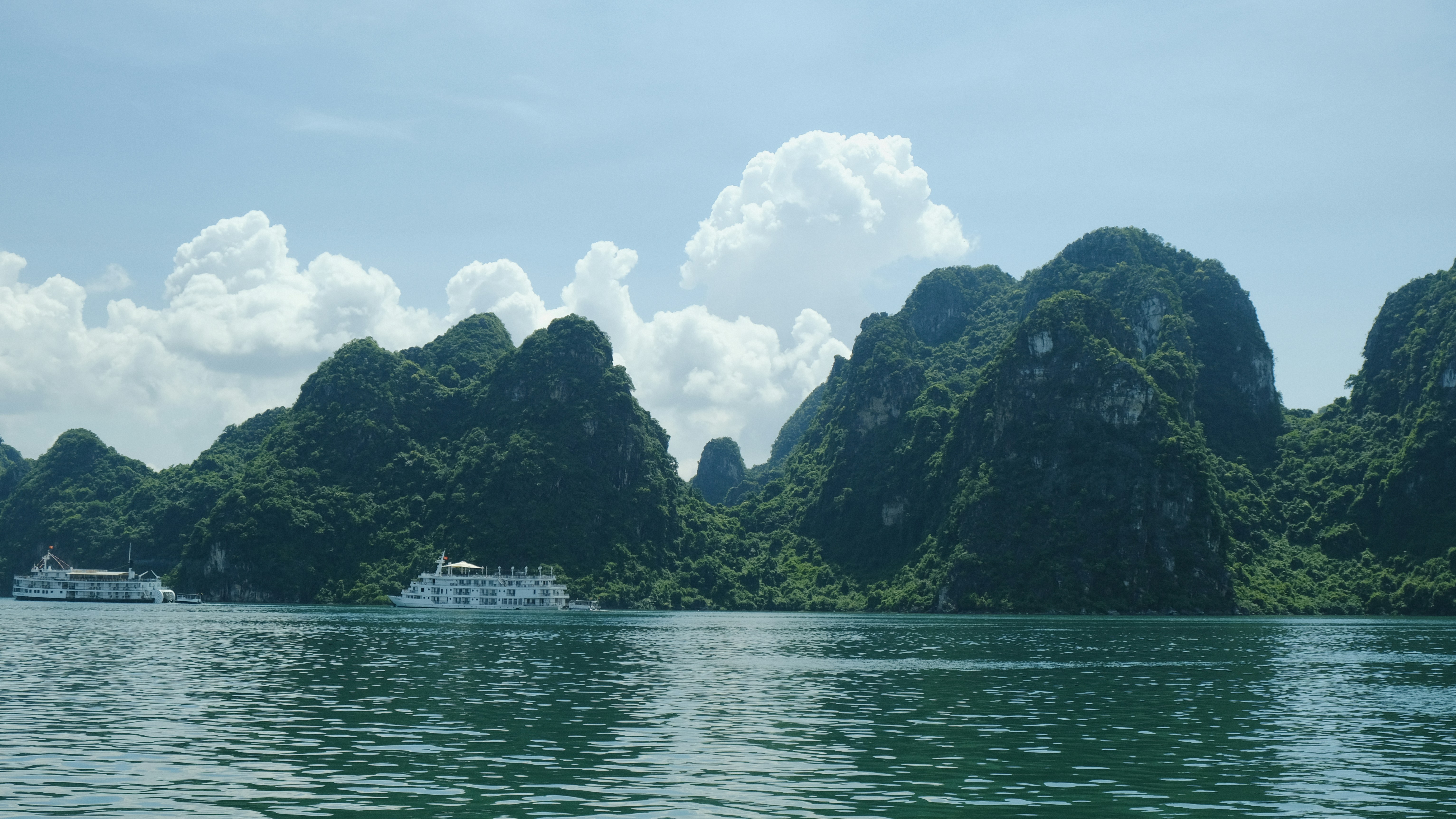 A large body of water with mountains in the background