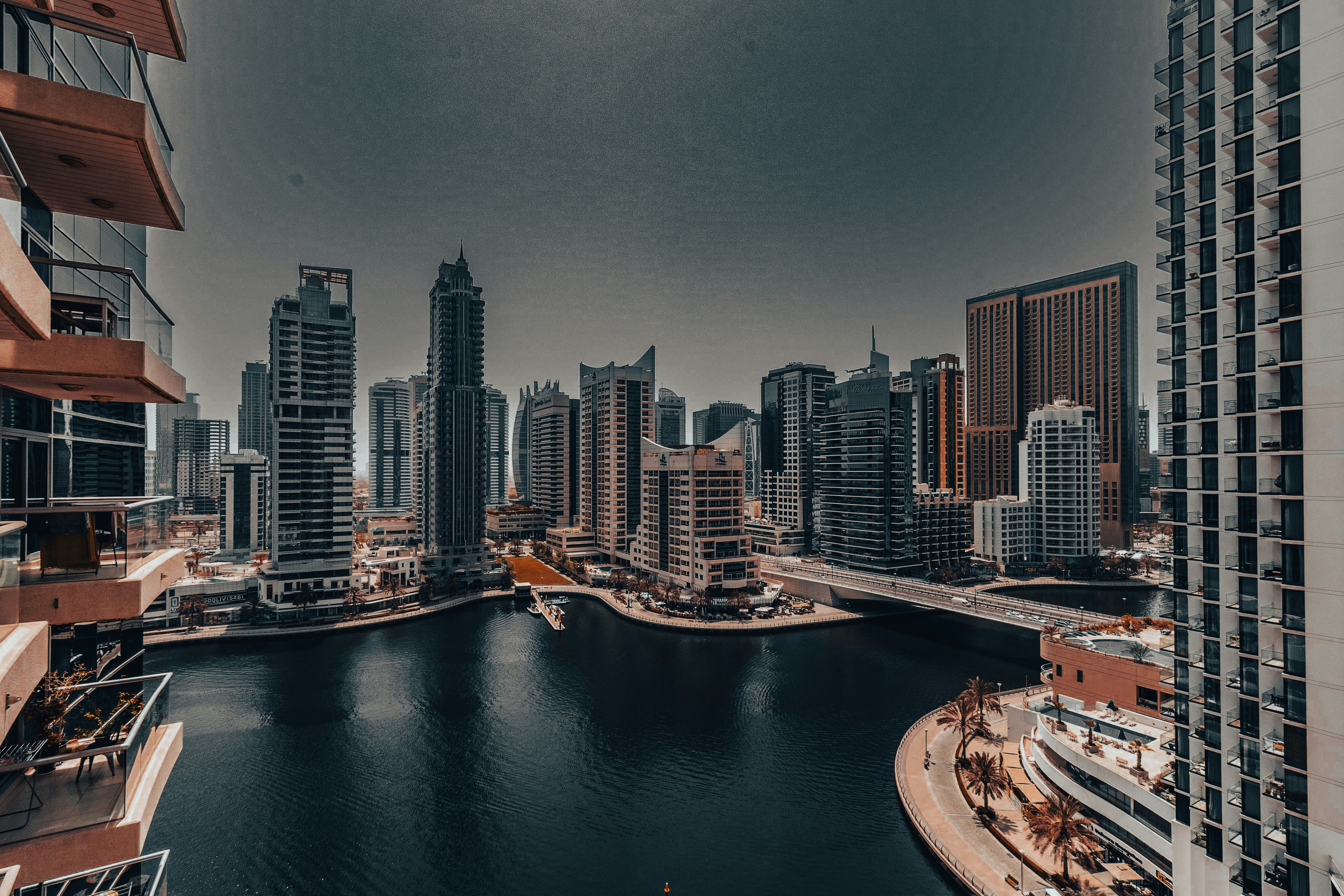 A large body of water surrounded by tall buildings