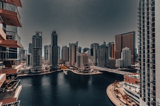 A large body of water surrounded by tall buildings