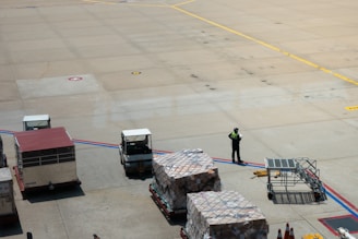 A man standing on the tarmac of an airport