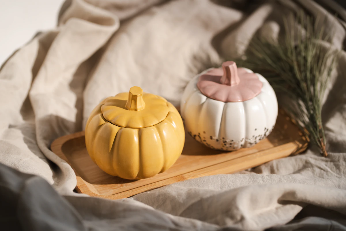 Small pumpkins sitting on a wooden tray