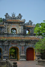 An old building with a red door and a red door