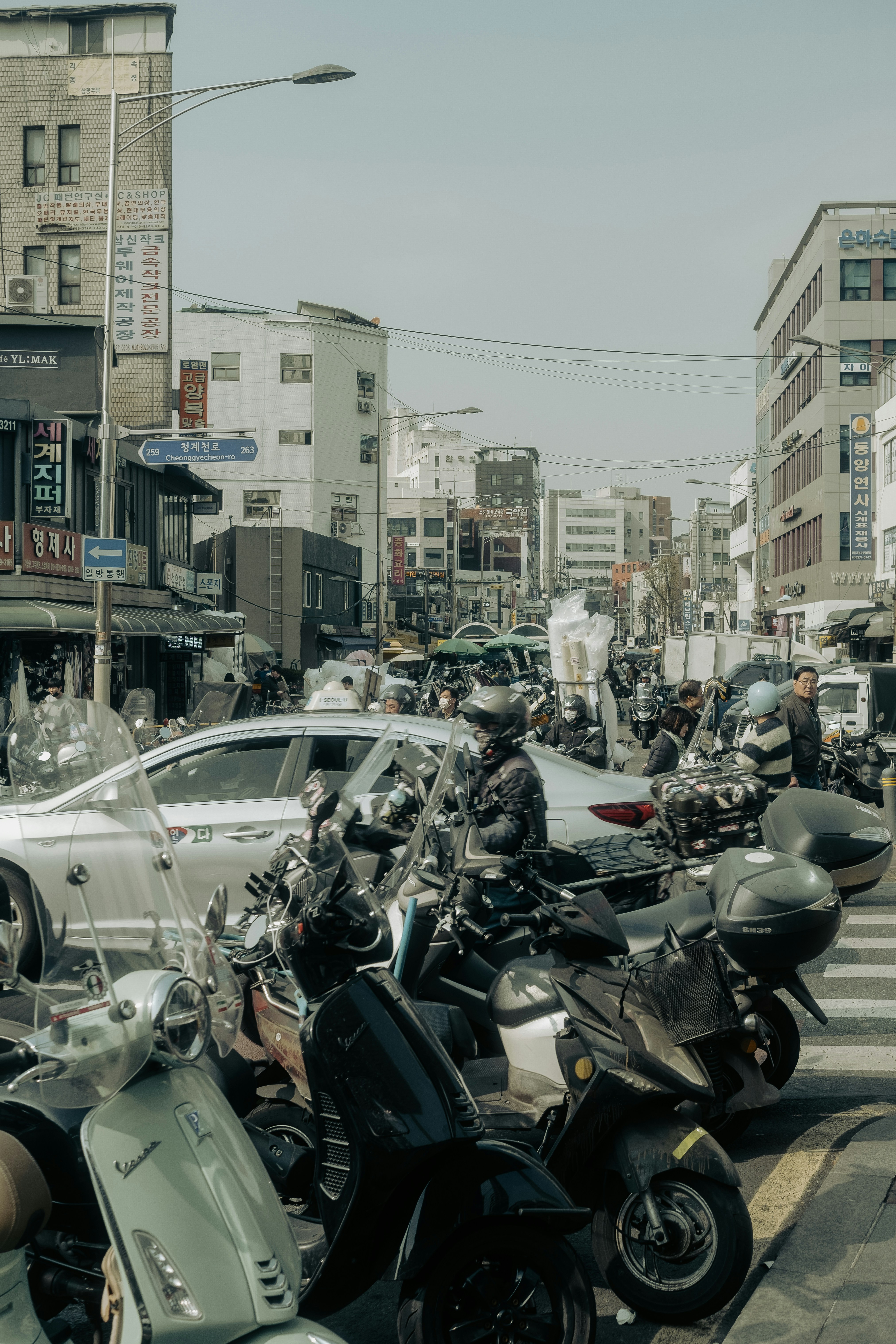A group of motorcycles parked on the side of a road