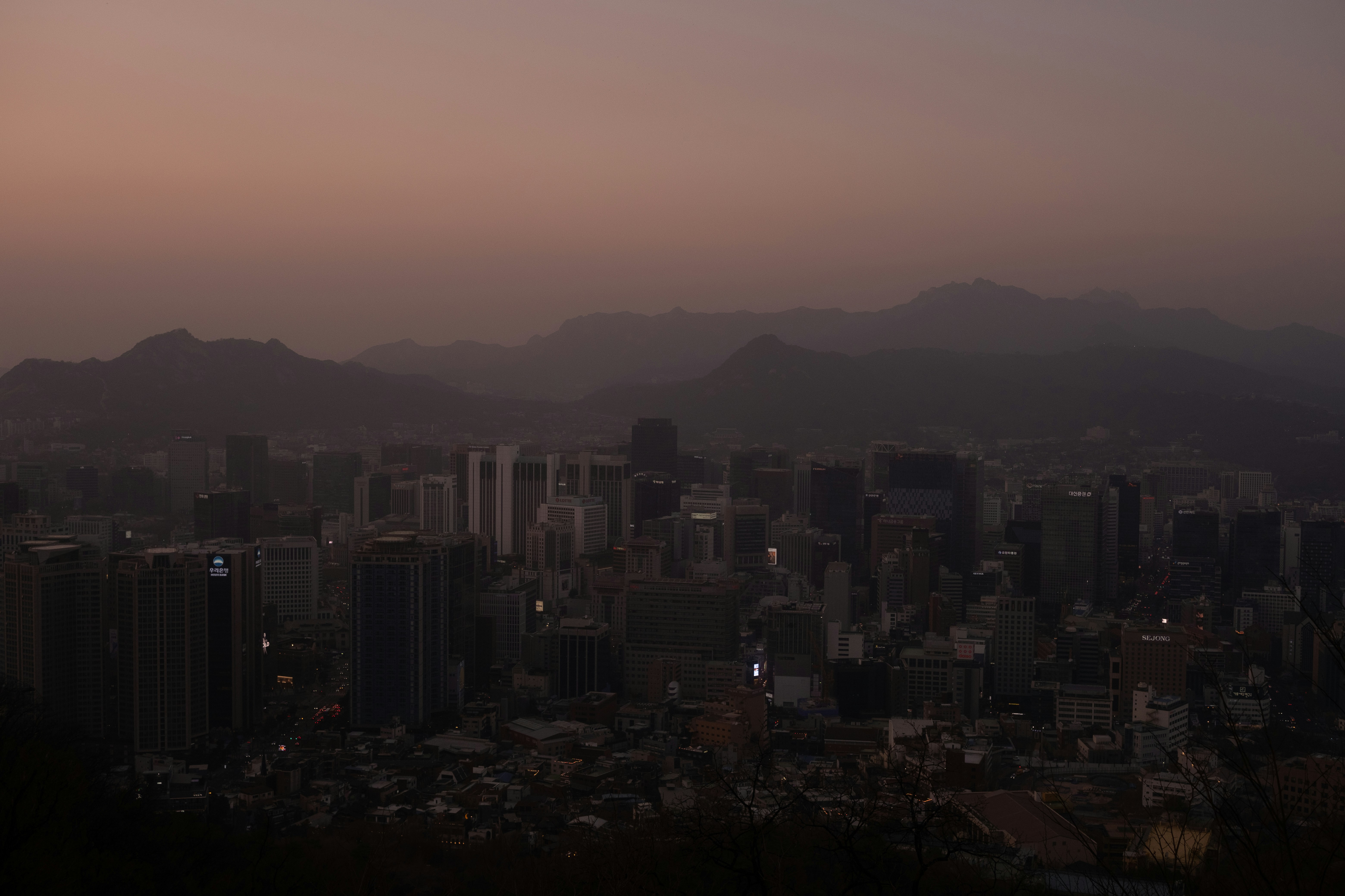 A view of a city with mountains in the background