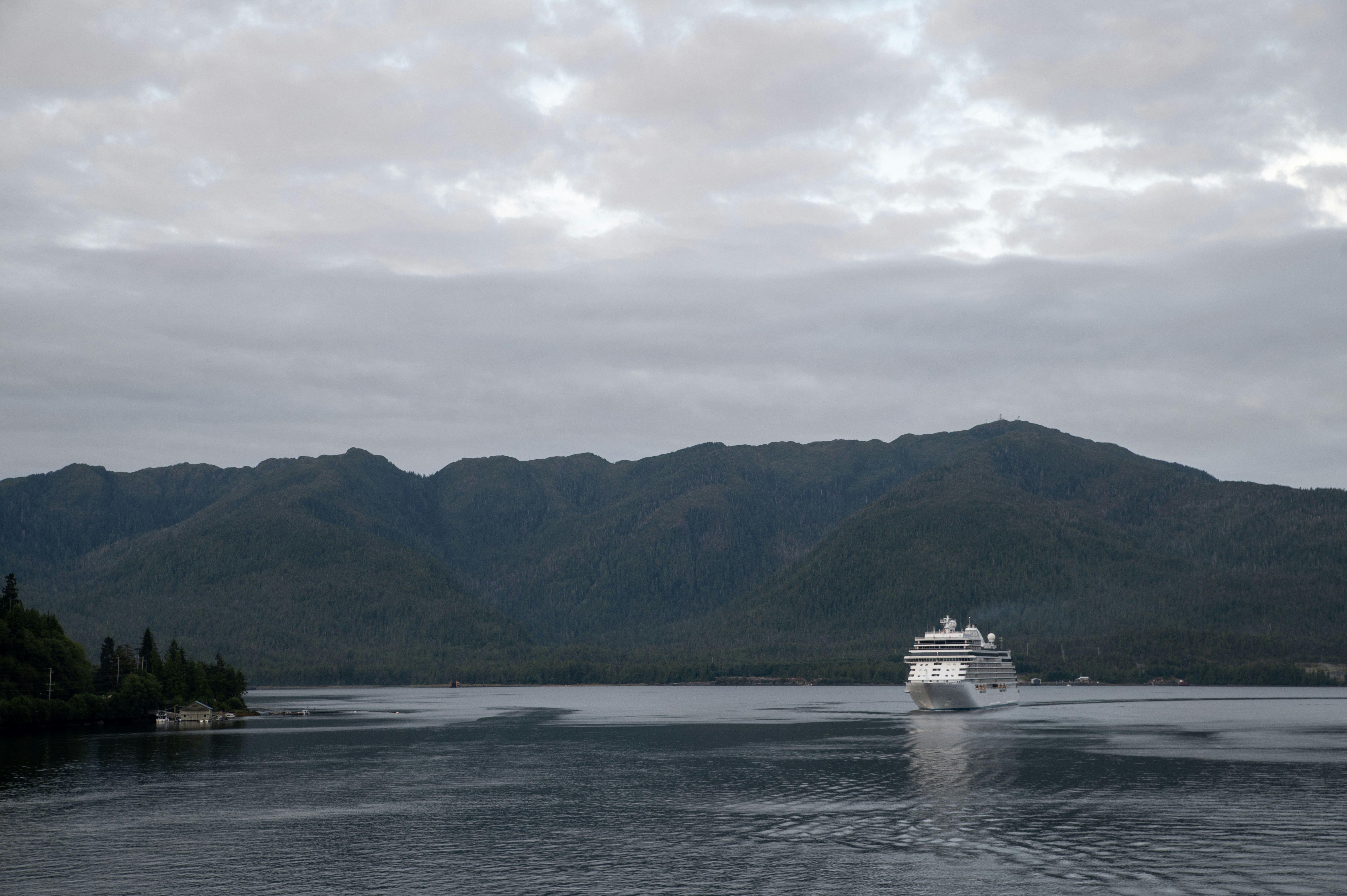 A large white boat in a large body of water