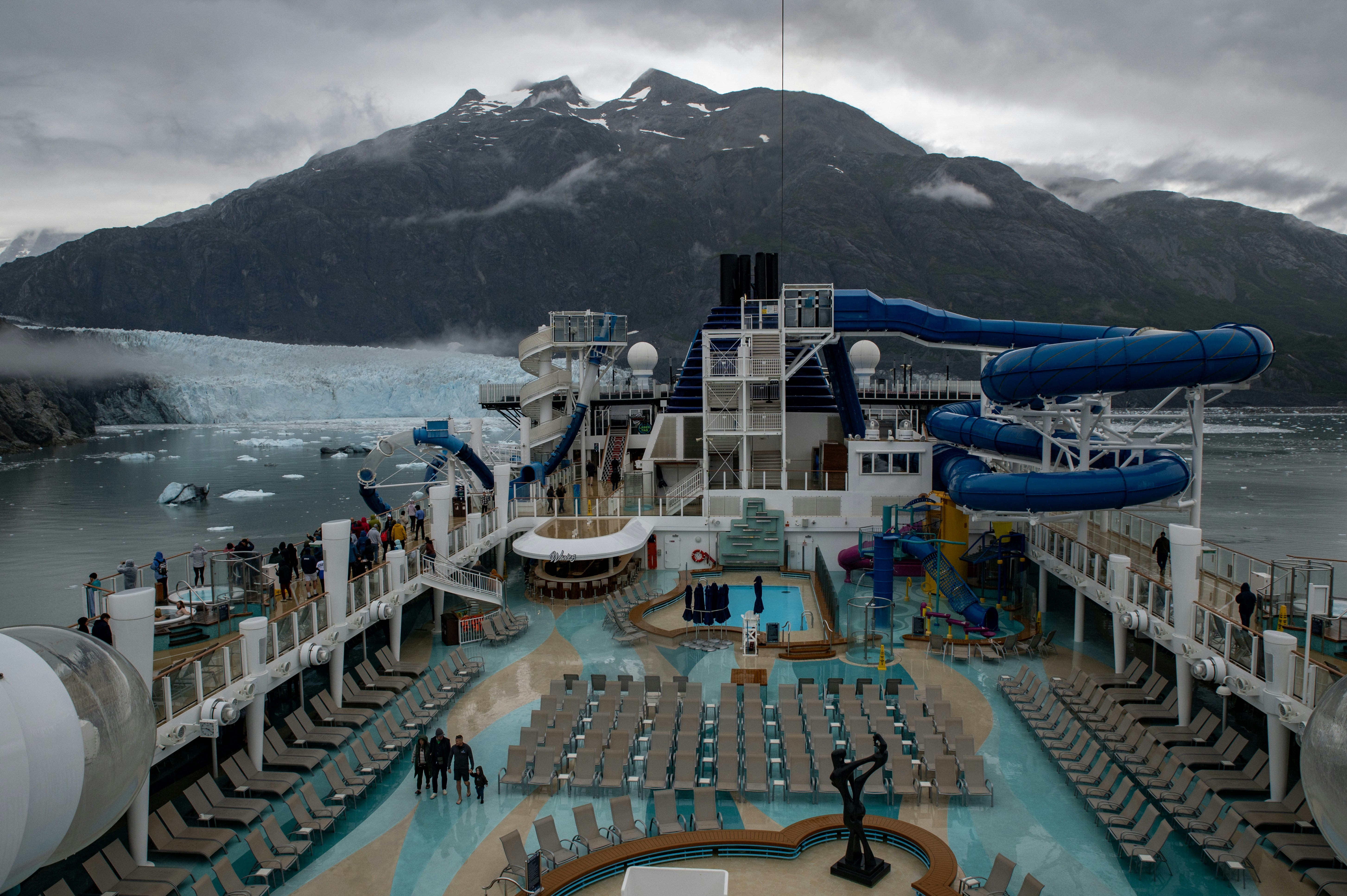A cruise ship with a pool and water slide