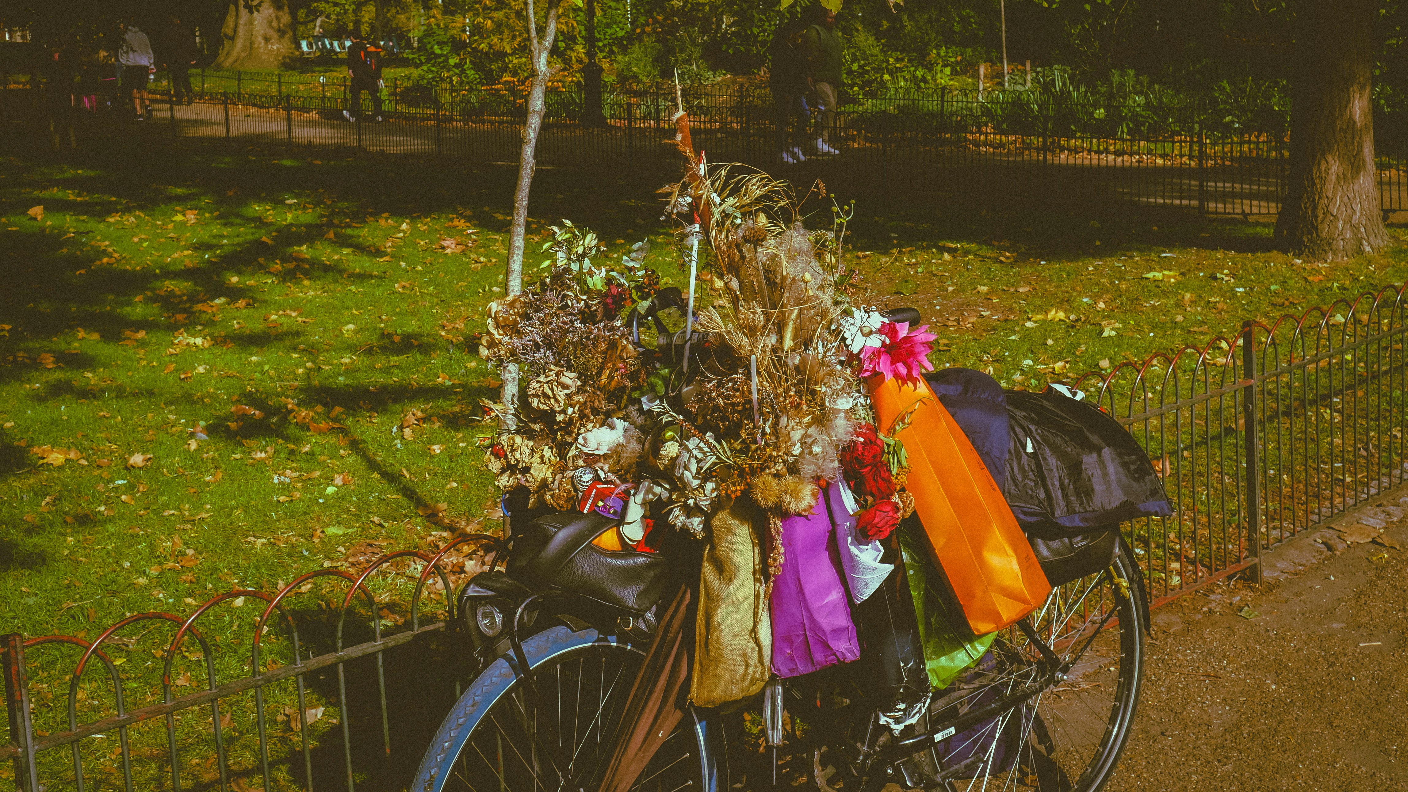 A bicycle with a basket full of flowers
