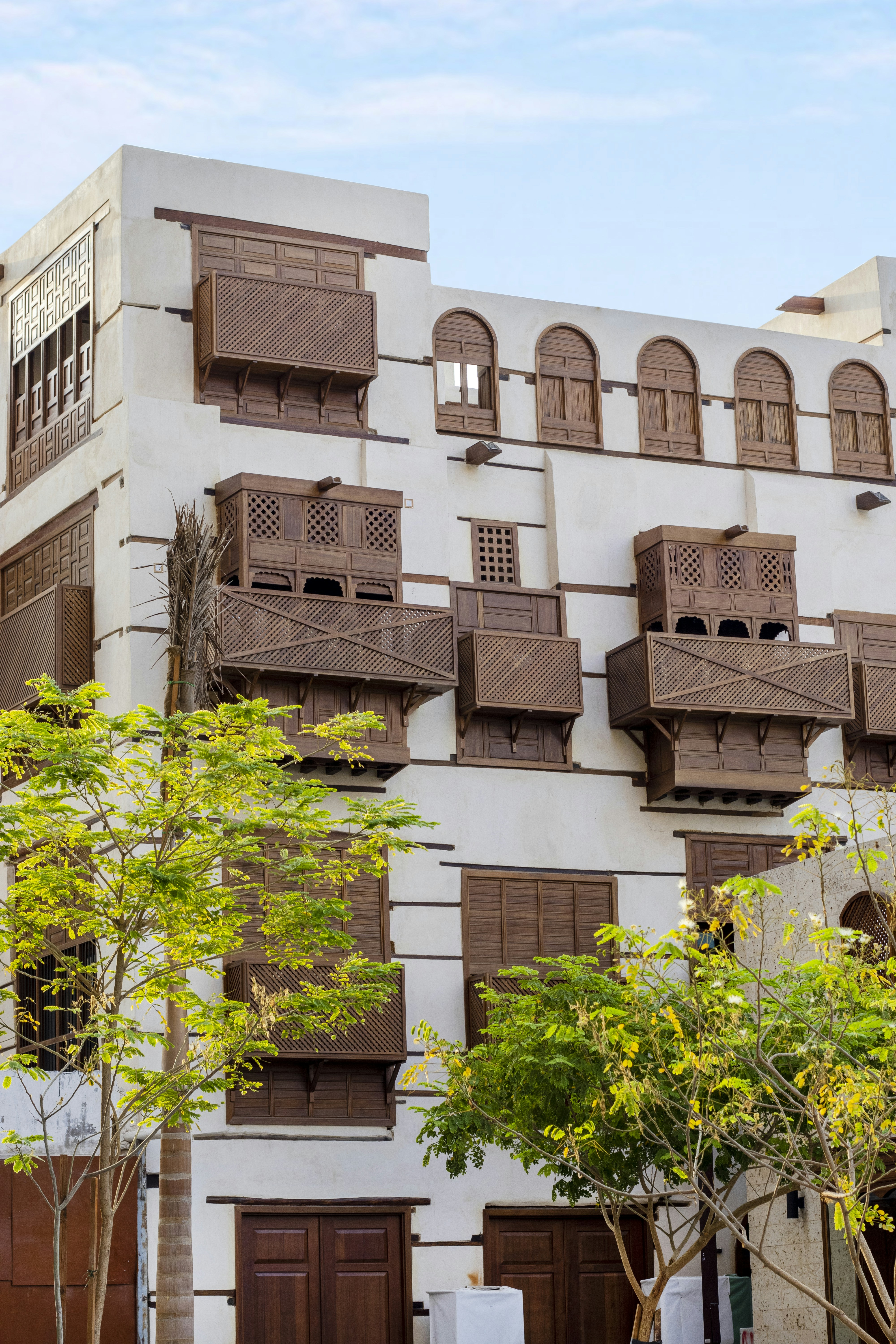 A tall building with many balconies on it