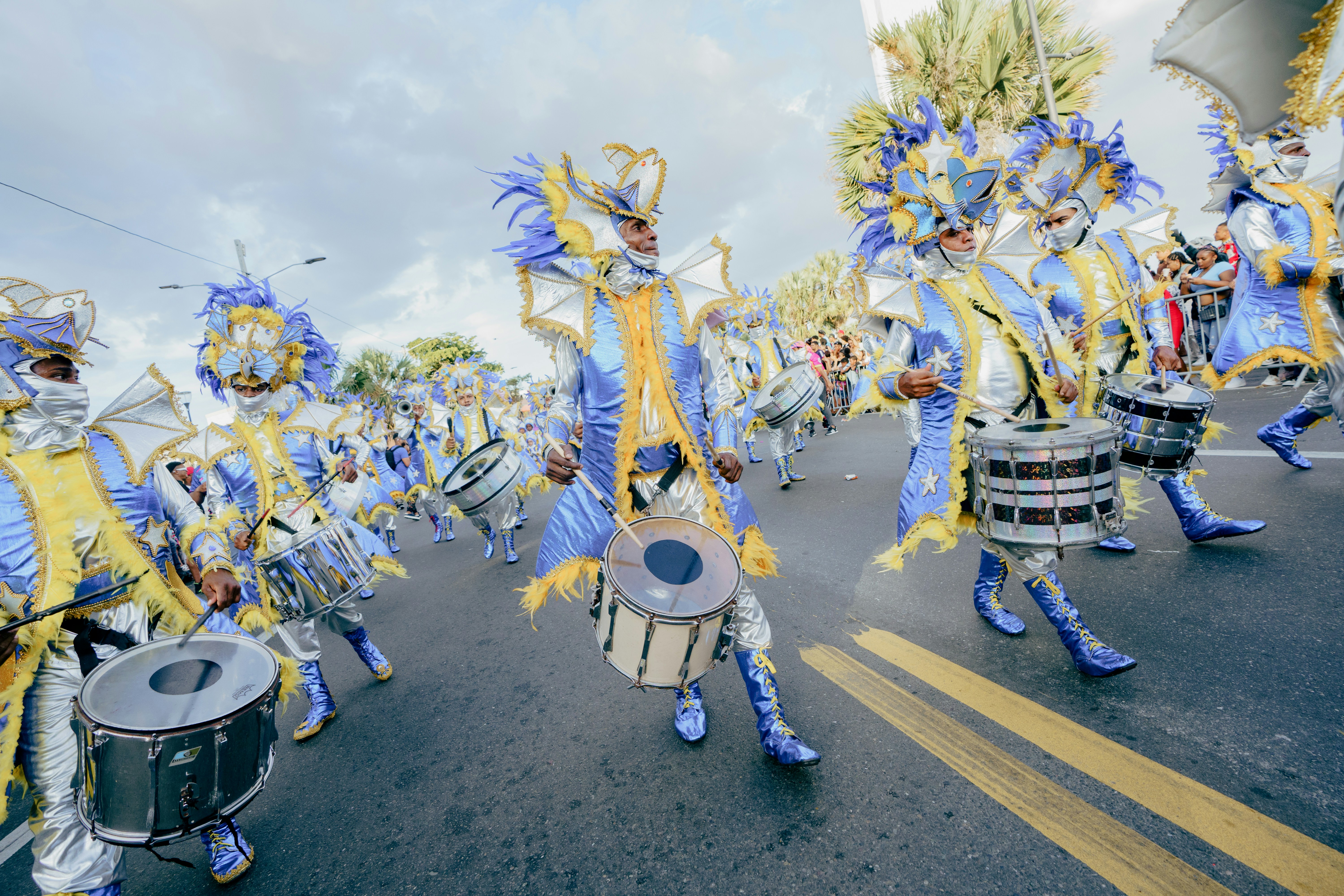A group of people that are standing in the street