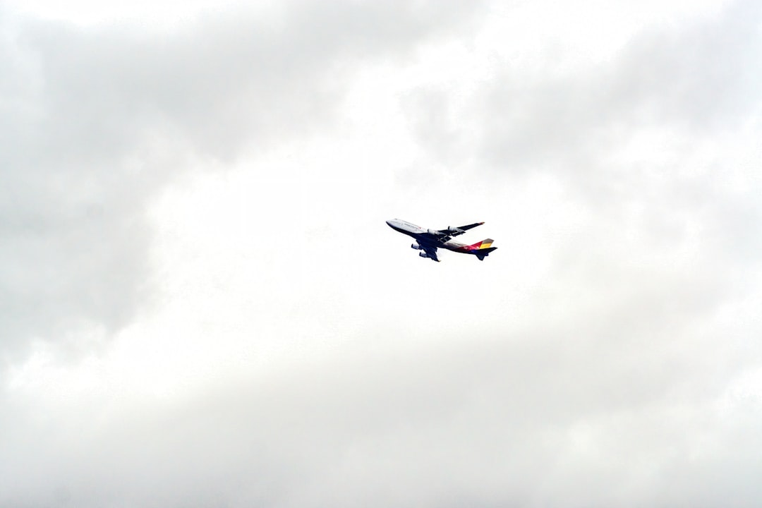 An airplane is flying in the cloudy sky, airplane on the sky