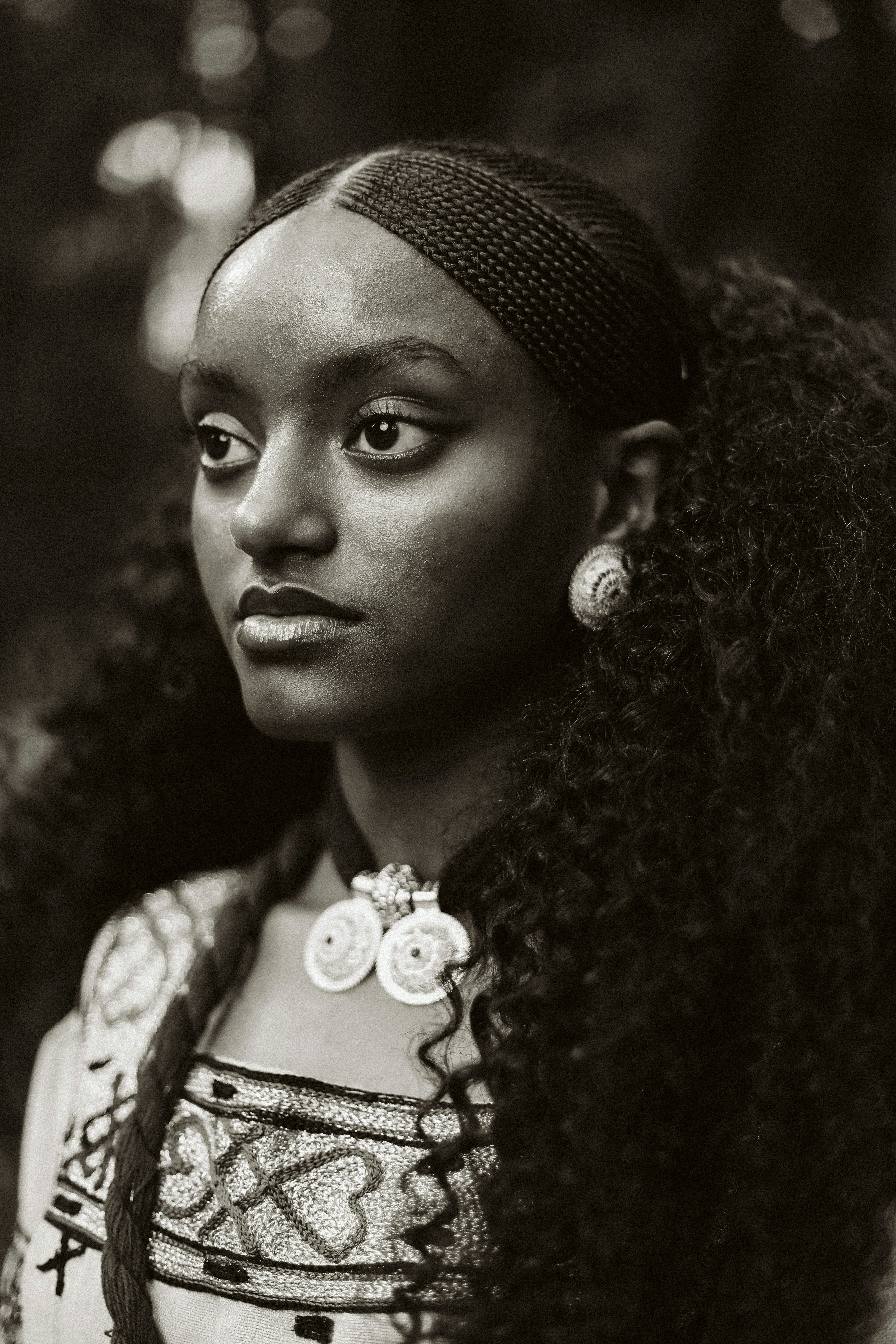 A black and white photo of a woman with long hair