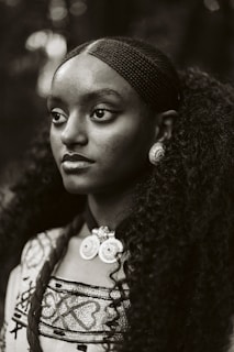 A black and white photo of a woman with long hair
