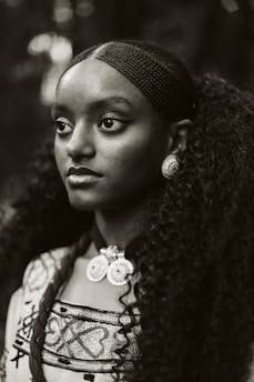 A black and white photo of a woman with long hair