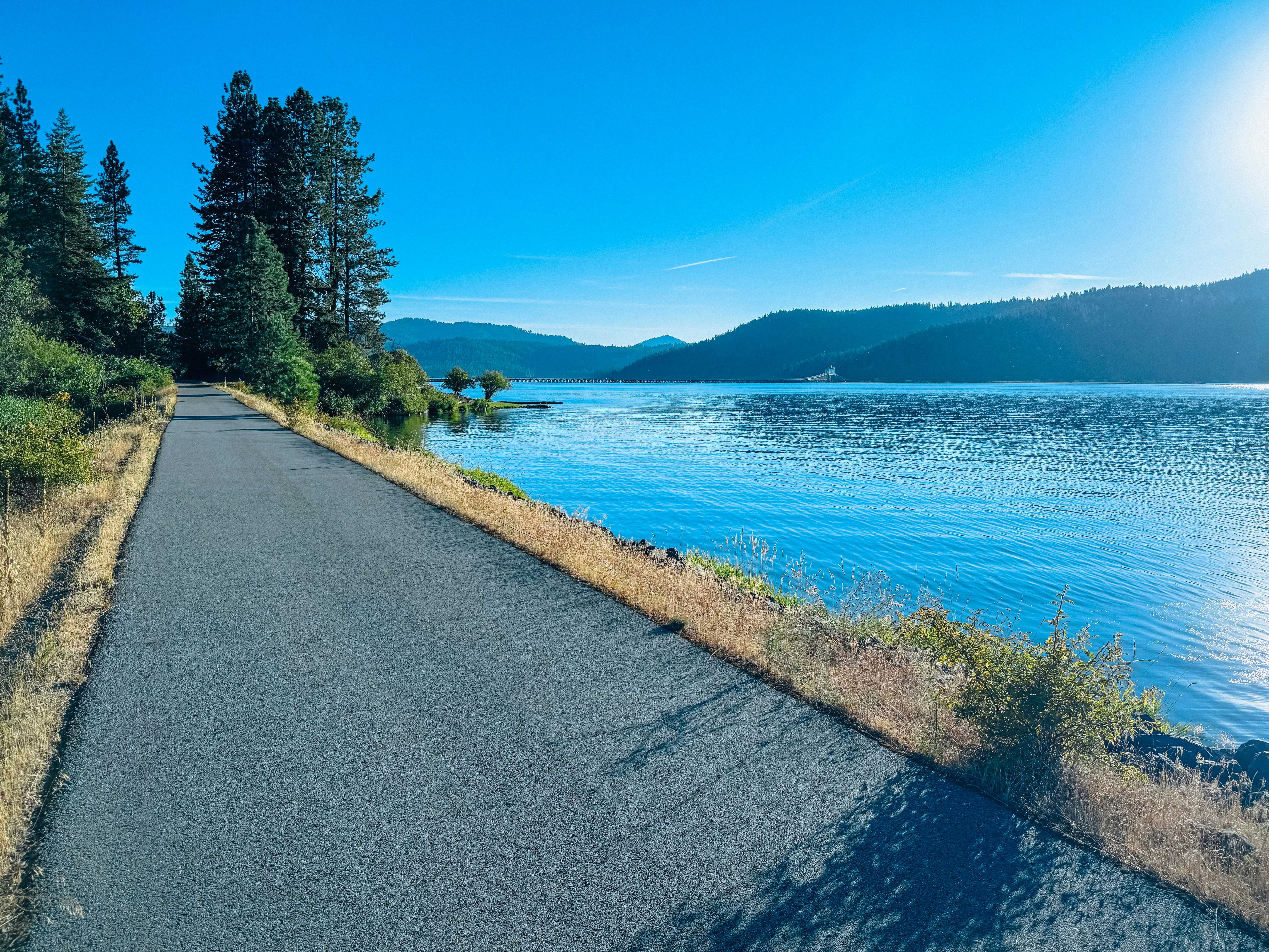 A scenic view of a road near a body of water