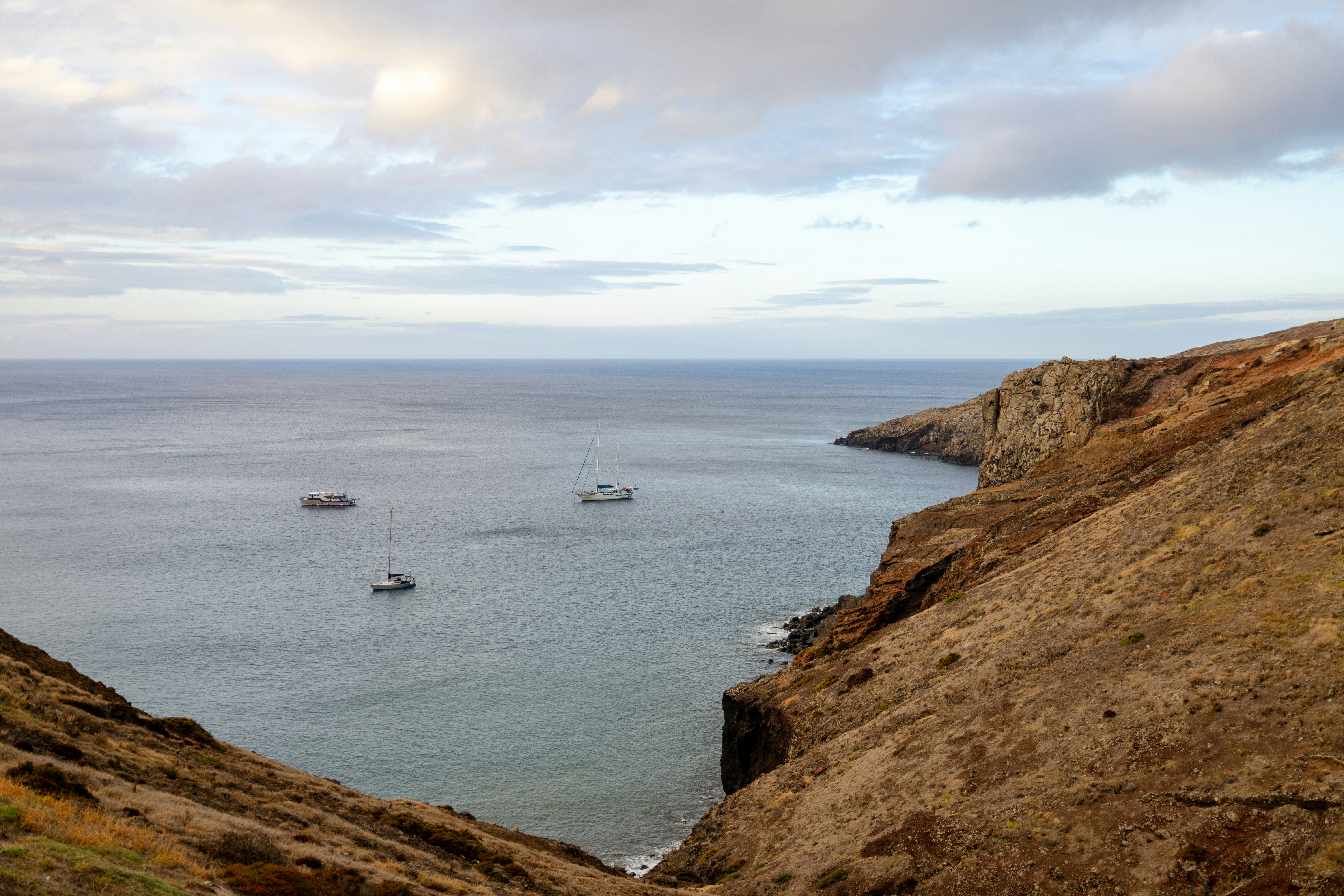 A view of a body of water from a hill, 