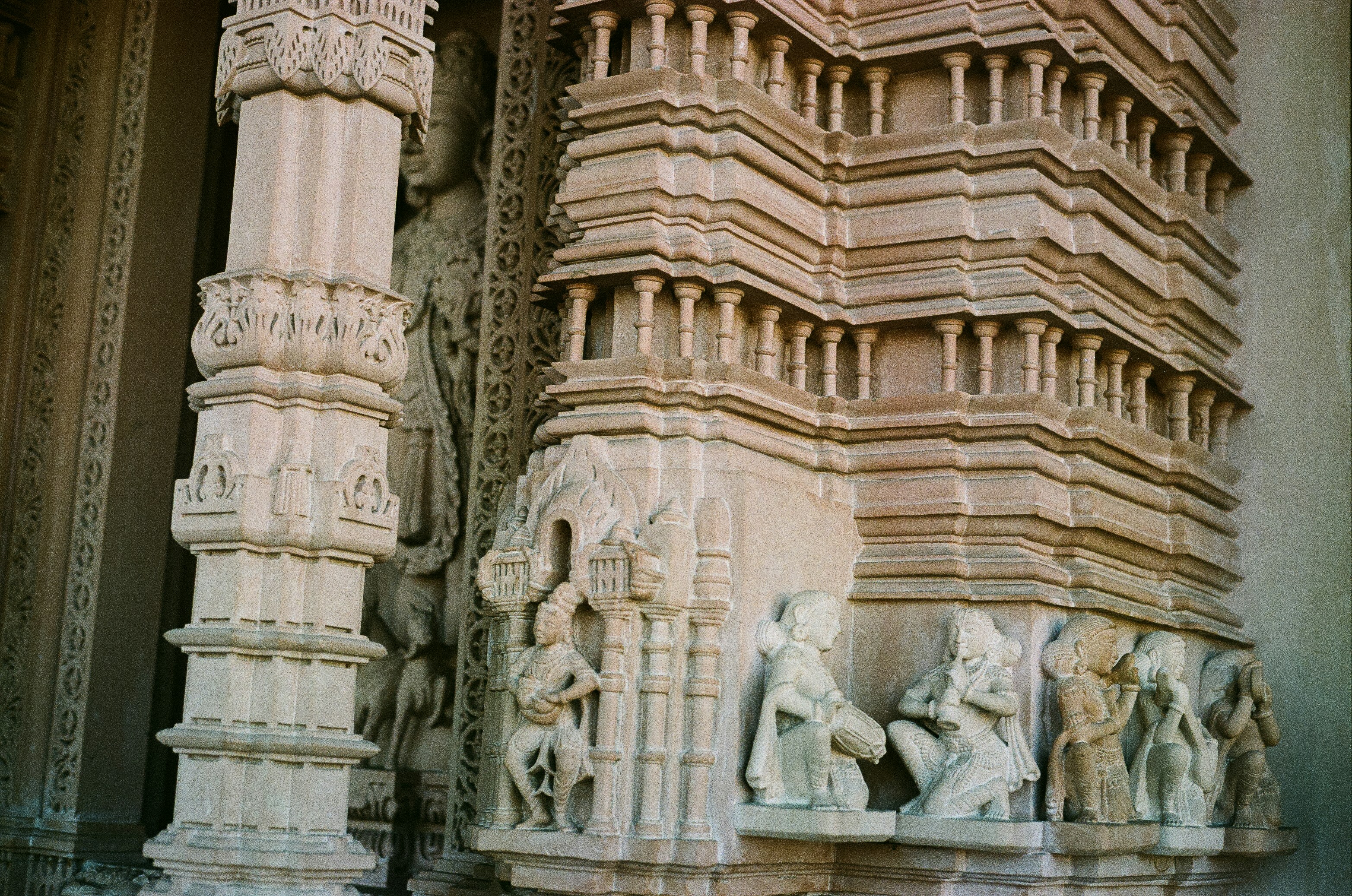 A close up of a building with statues on it