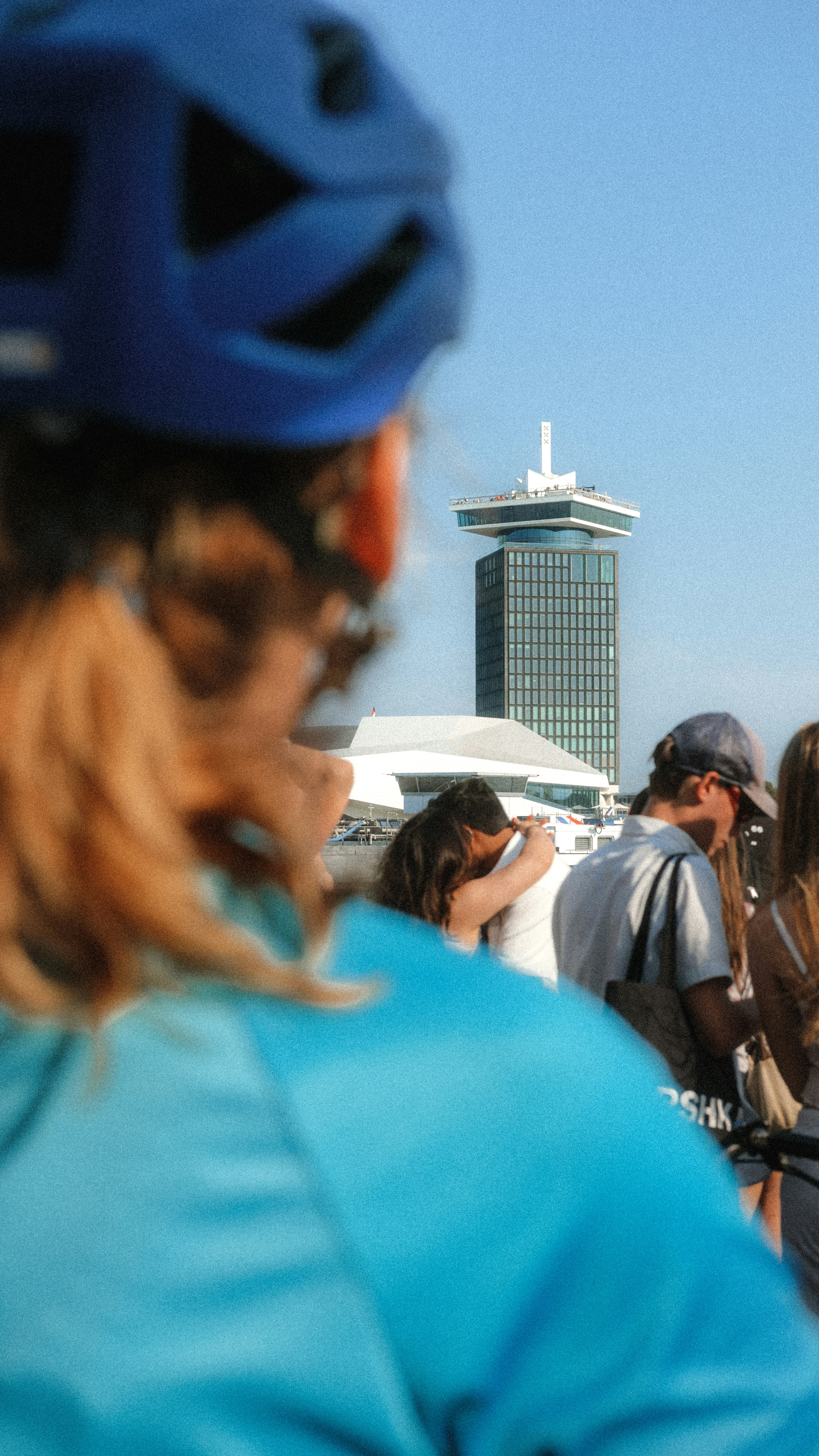 A group of people riding bikes on top of a bridge