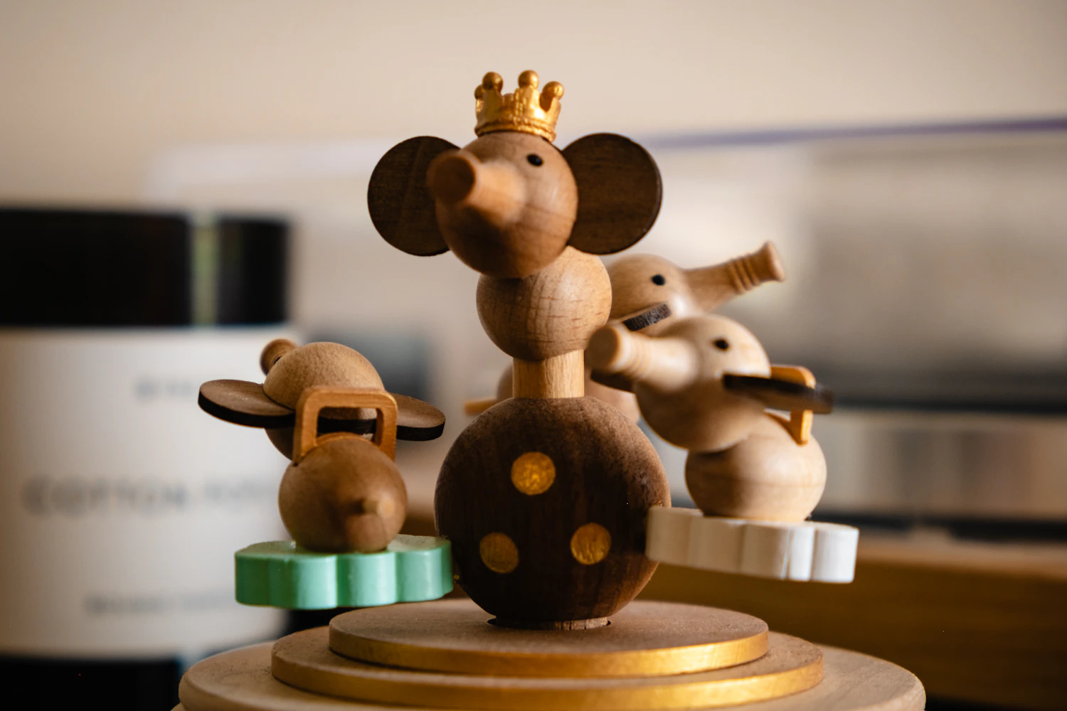 Three turned wooden mice on a round base, one of them wearing a small crown — Mouse Band, in stock