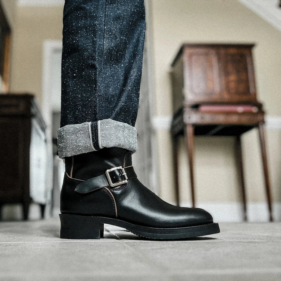 Selvedge denim jeans cuffed above leather boots, Japan
