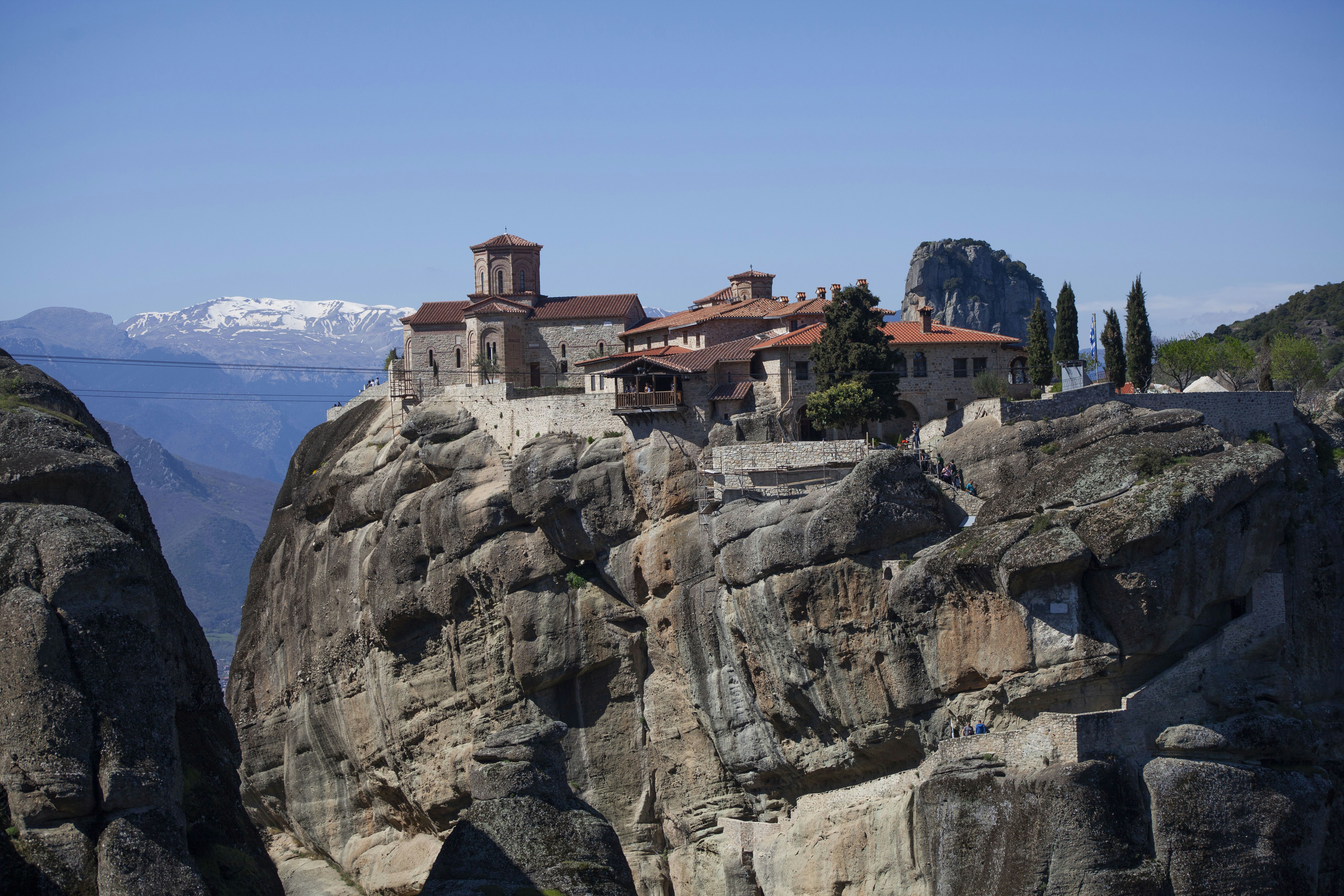 A castle on top of a rock in the mountains