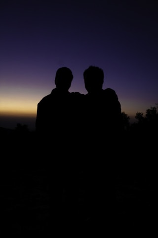 A couple of people standing next to each other