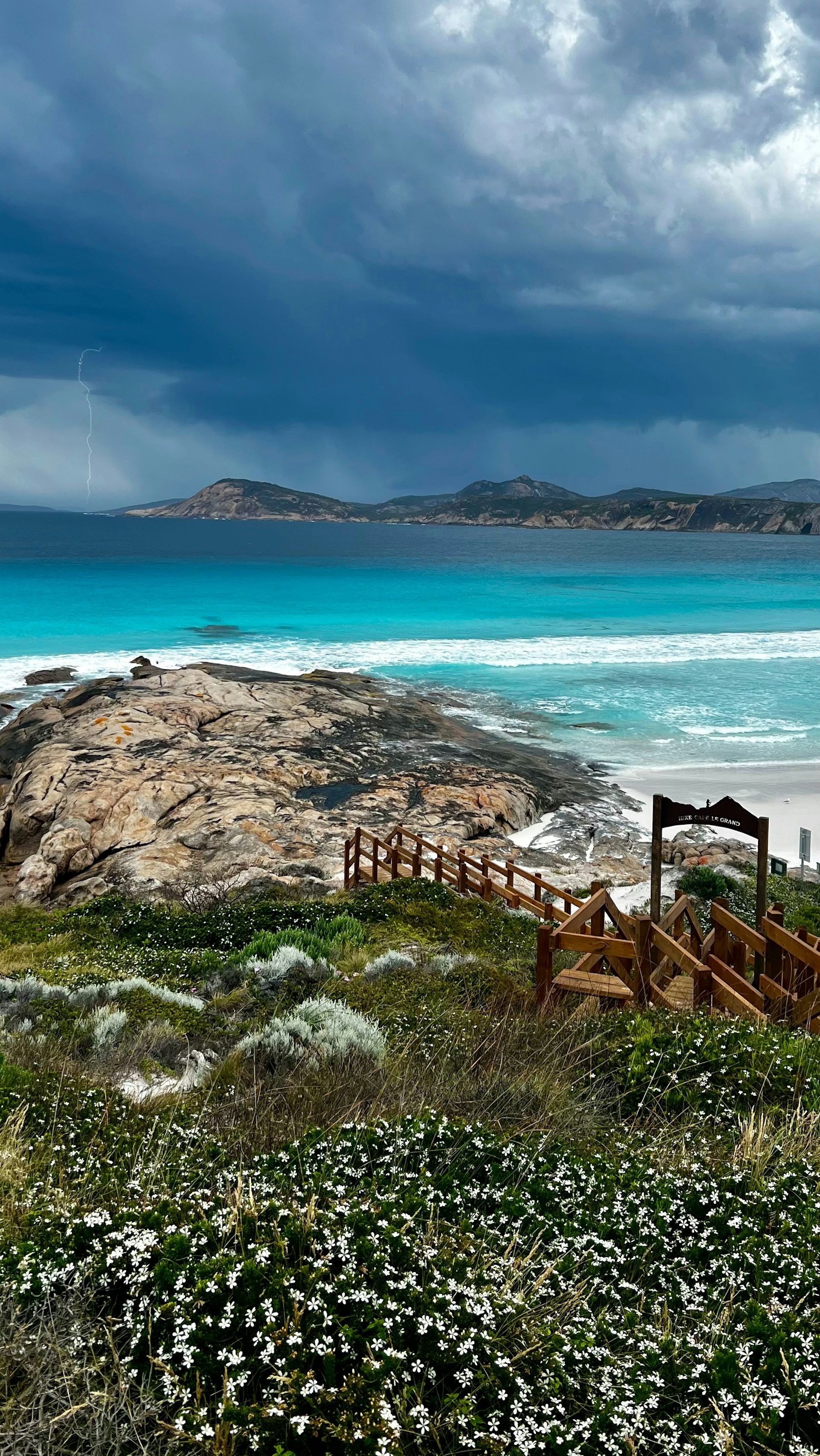 A view of a beach with a cloudy sky