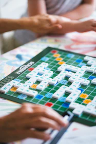 A group of people playing a game of scrabble