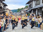 A group of people that are standing in the street