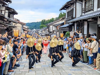 A group of people that are standing in the street