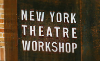 A sign that says new york theatre workshop