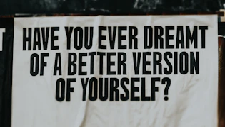 A white sign with black writing on it