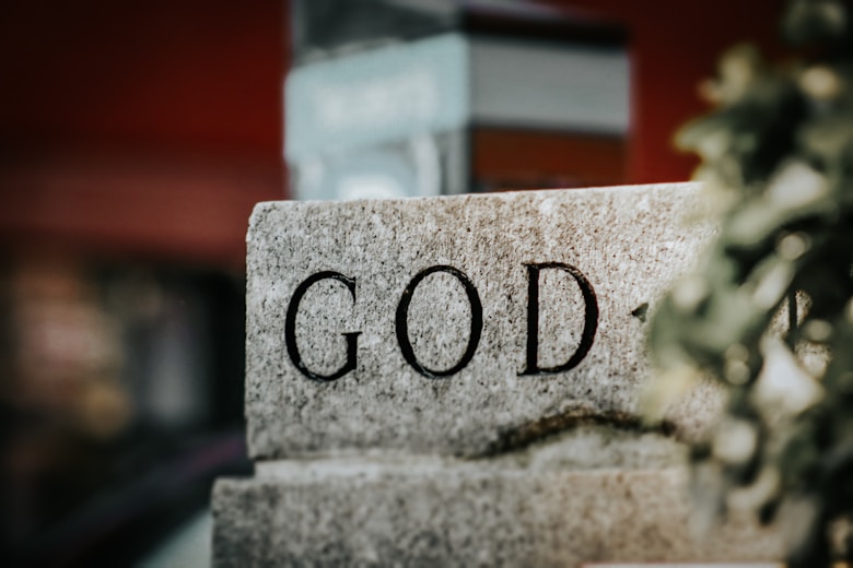 A stone block with the word god written on it