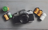 A camera, batteries, and batteries on a table