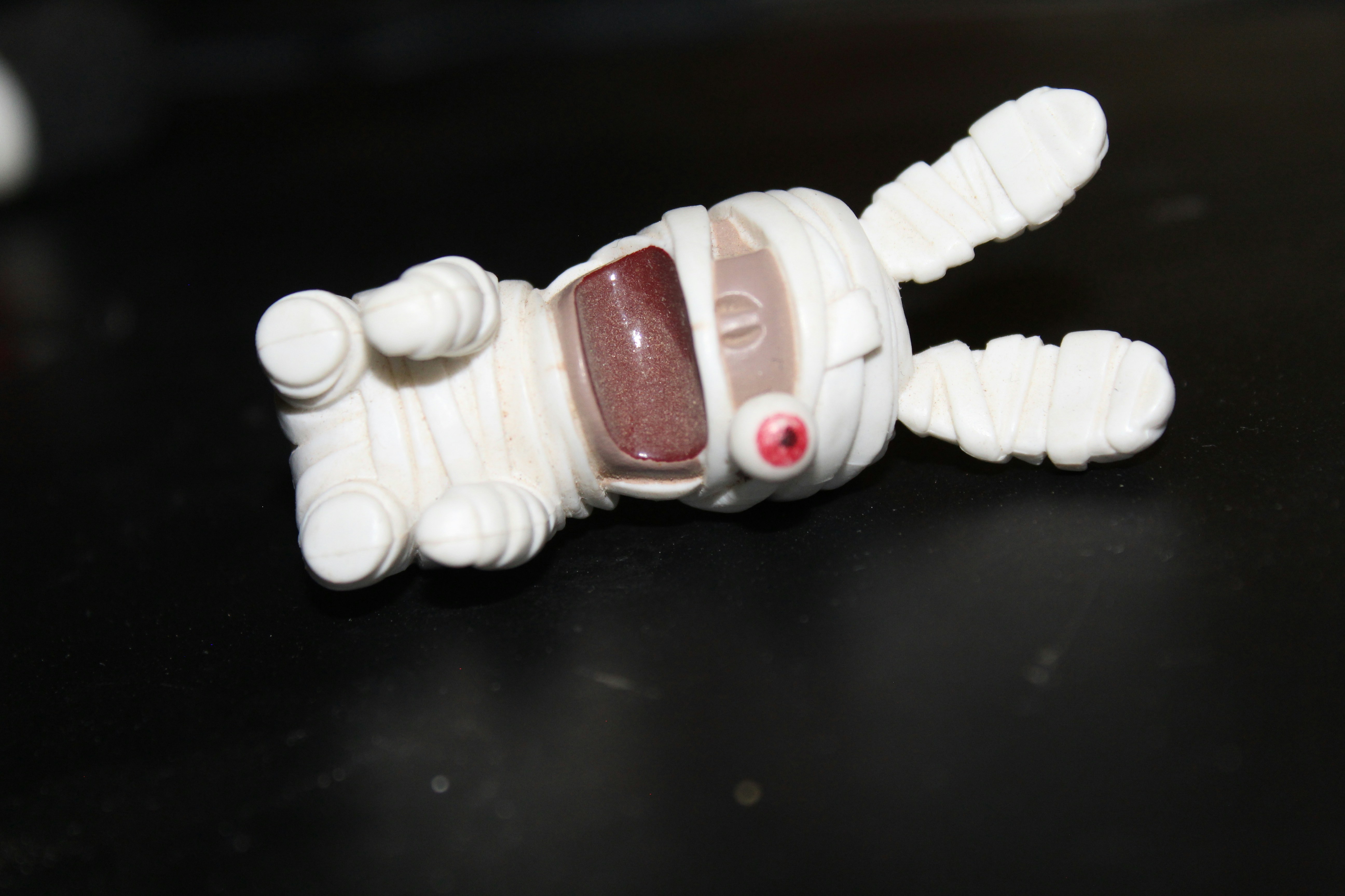 A plastic toy laying on top of a table