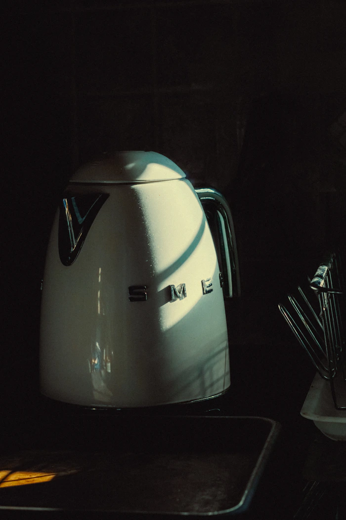 A cream electric kettle styled on a kitchen counter