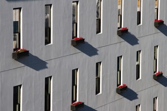 A building with many windows and a clock on it