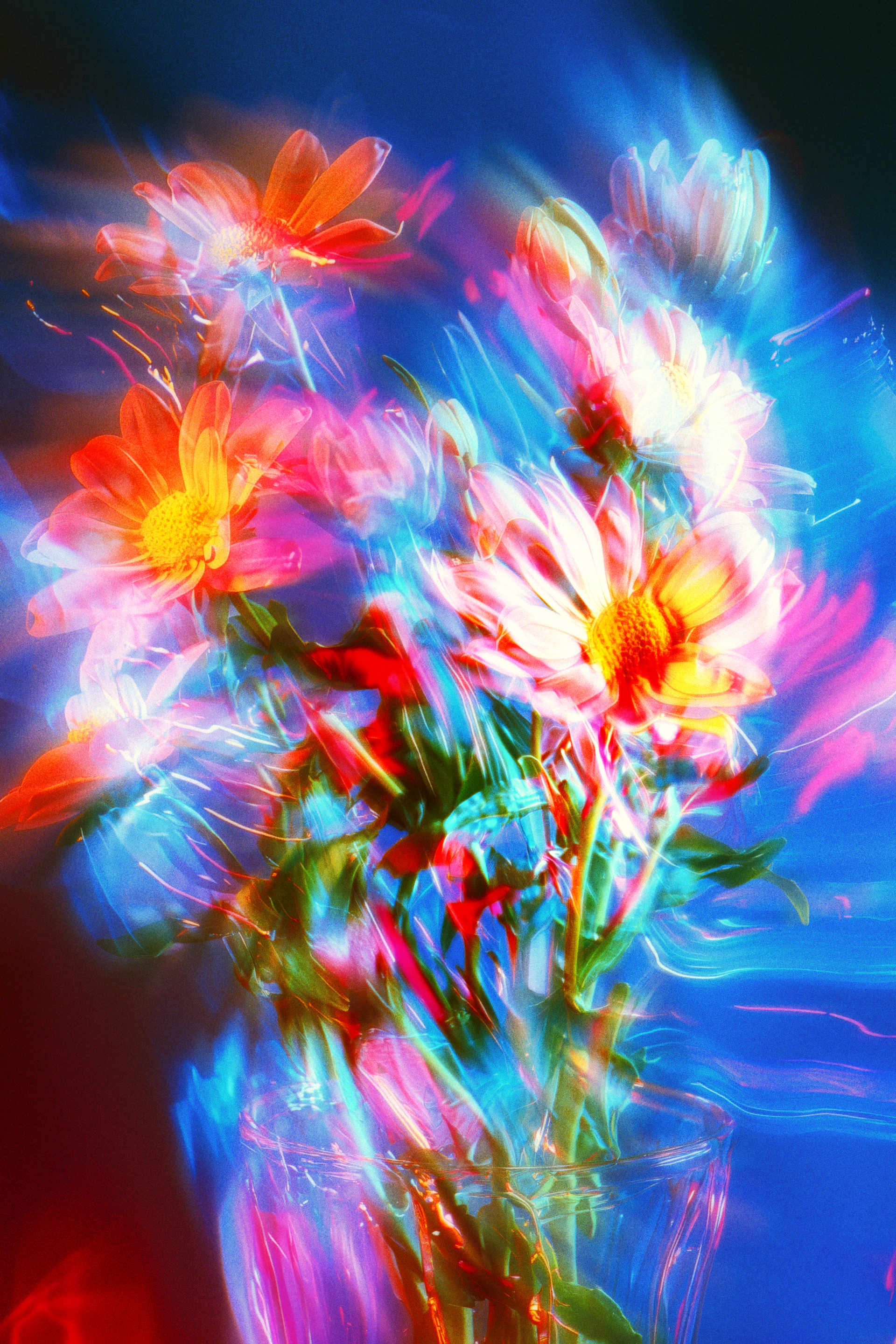 A vase filled with lots of colorful flowers