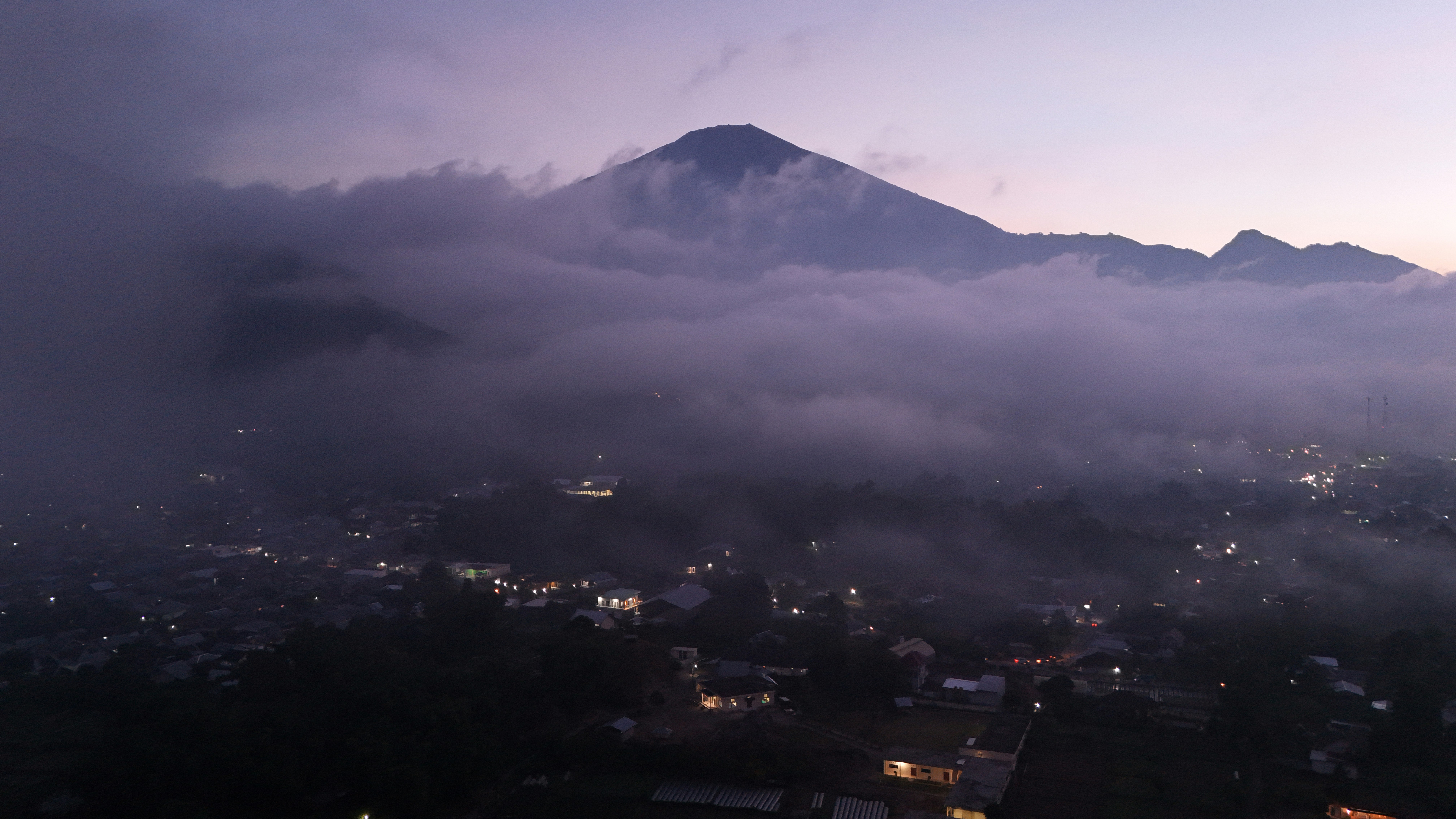A view of a city with a mountain in the background