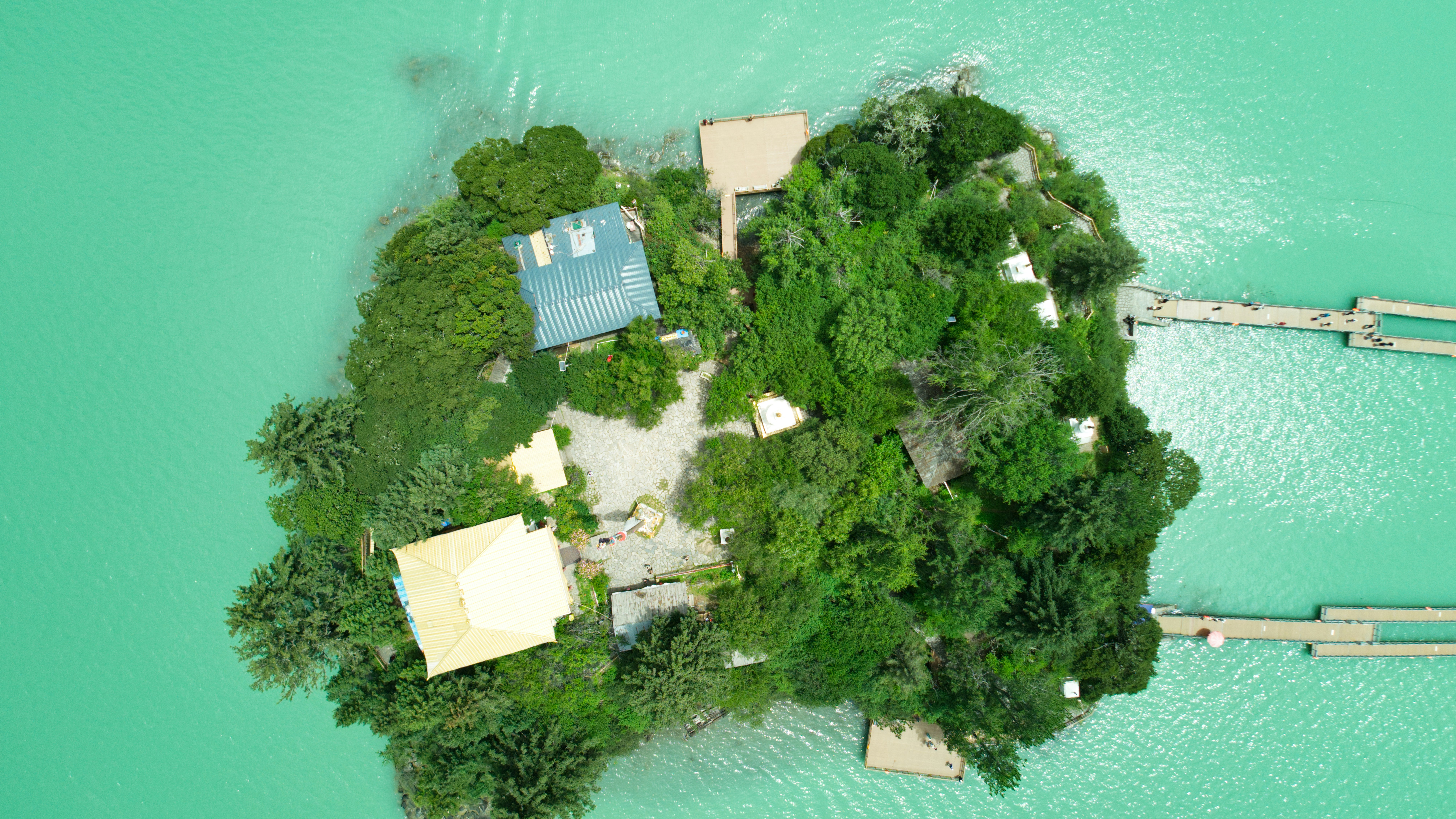 A small island in the middle of a body of water