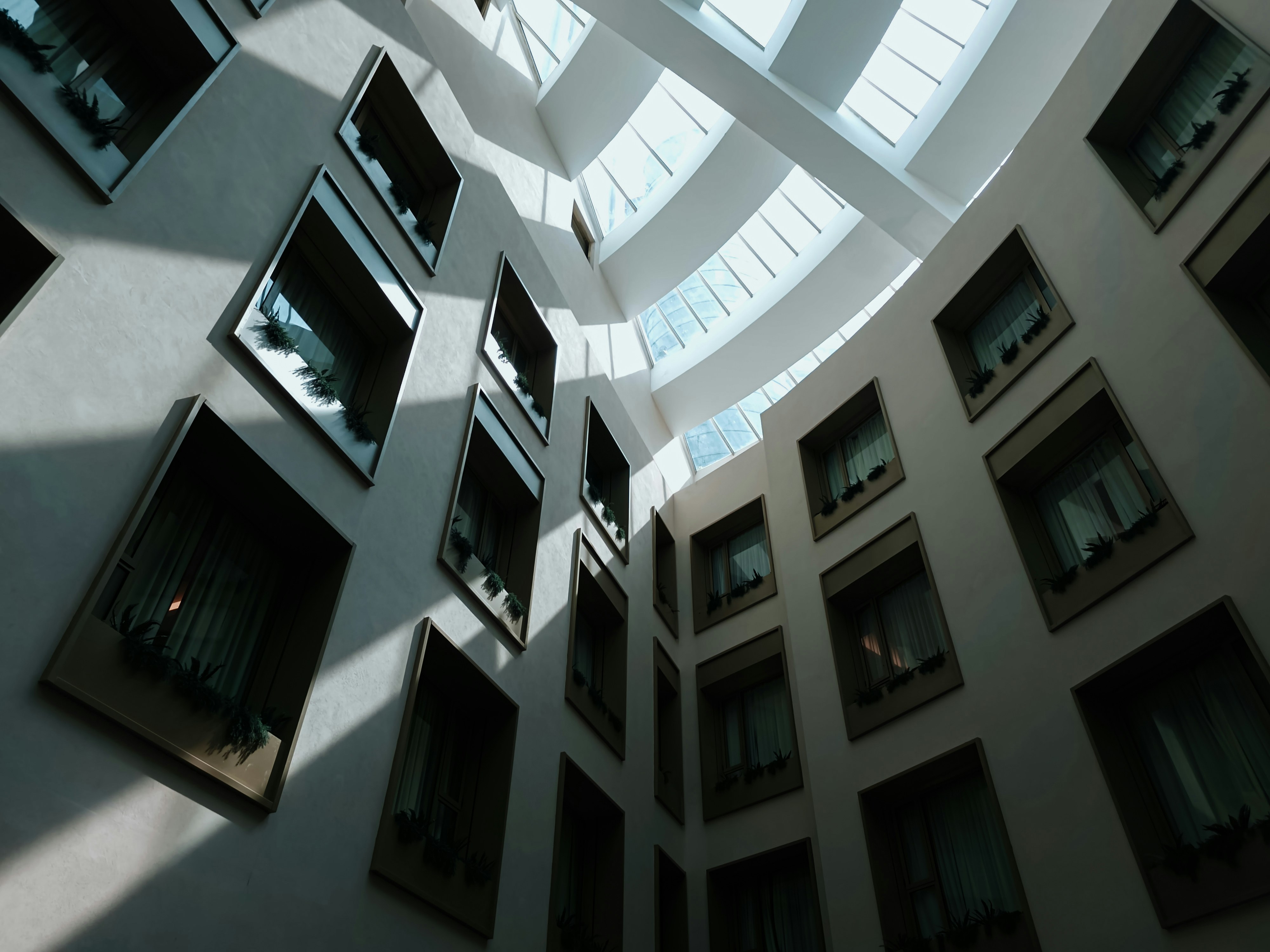 Modern civic center building interior with open atrium, natural light, clean architectural lines