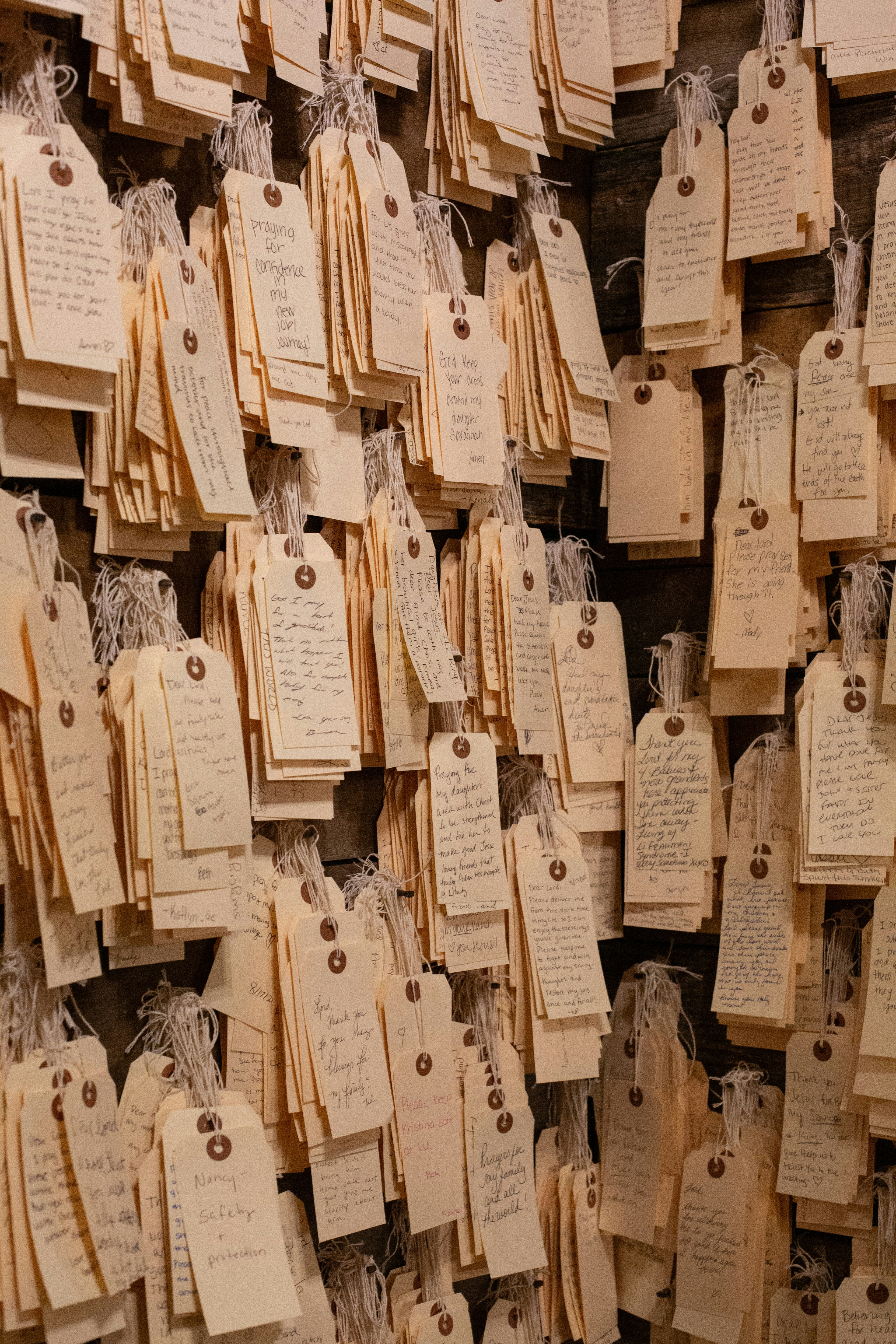 A wall covered in lots of small tags