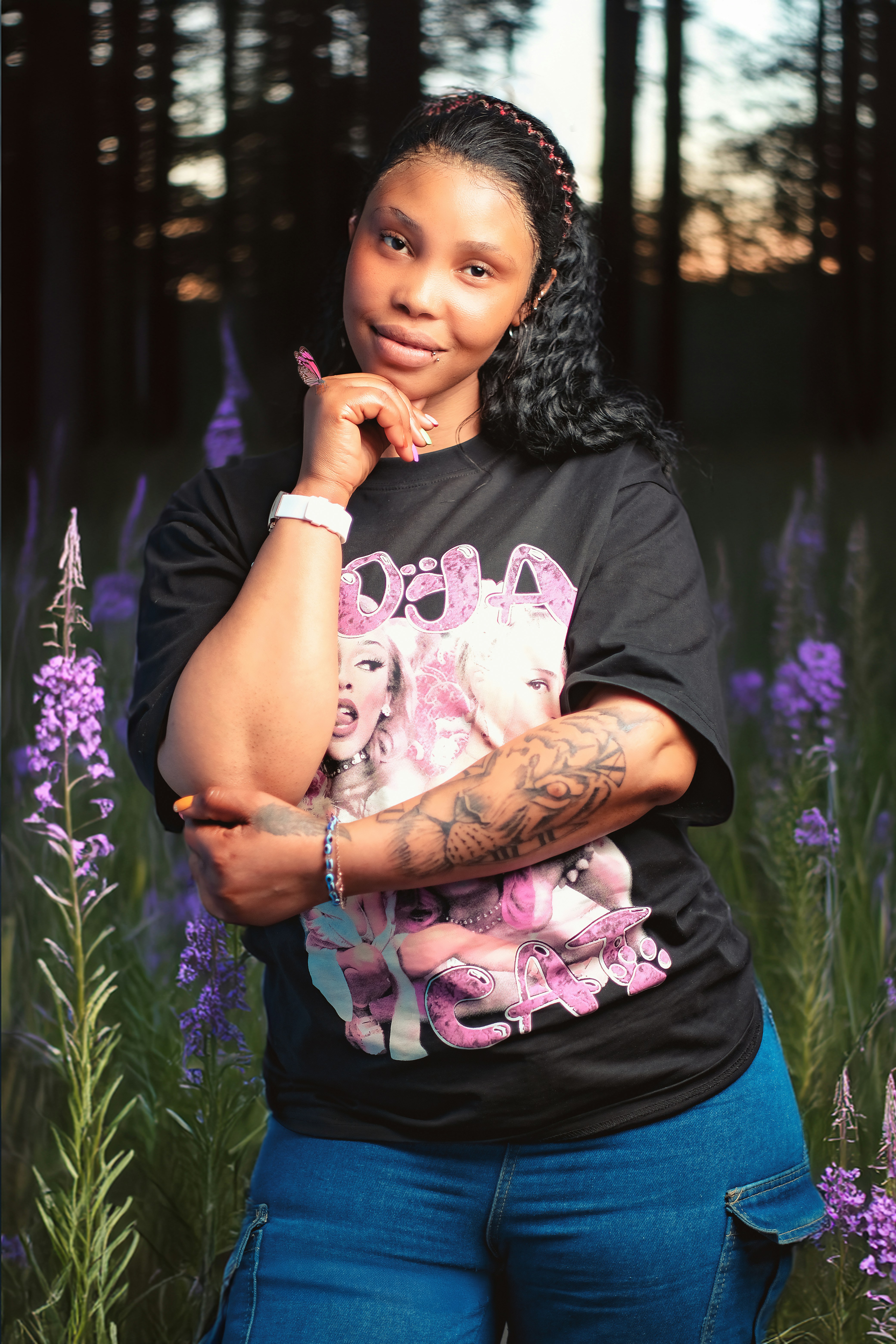 A woman standing in a field of purple flowers