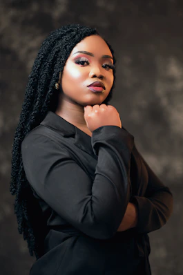 A woman in a black shirt is posing for a picture