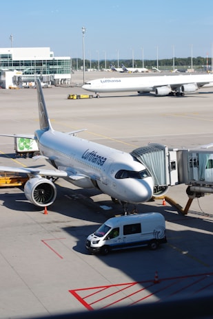 A large jetliner sitting on top of an airport tarmac