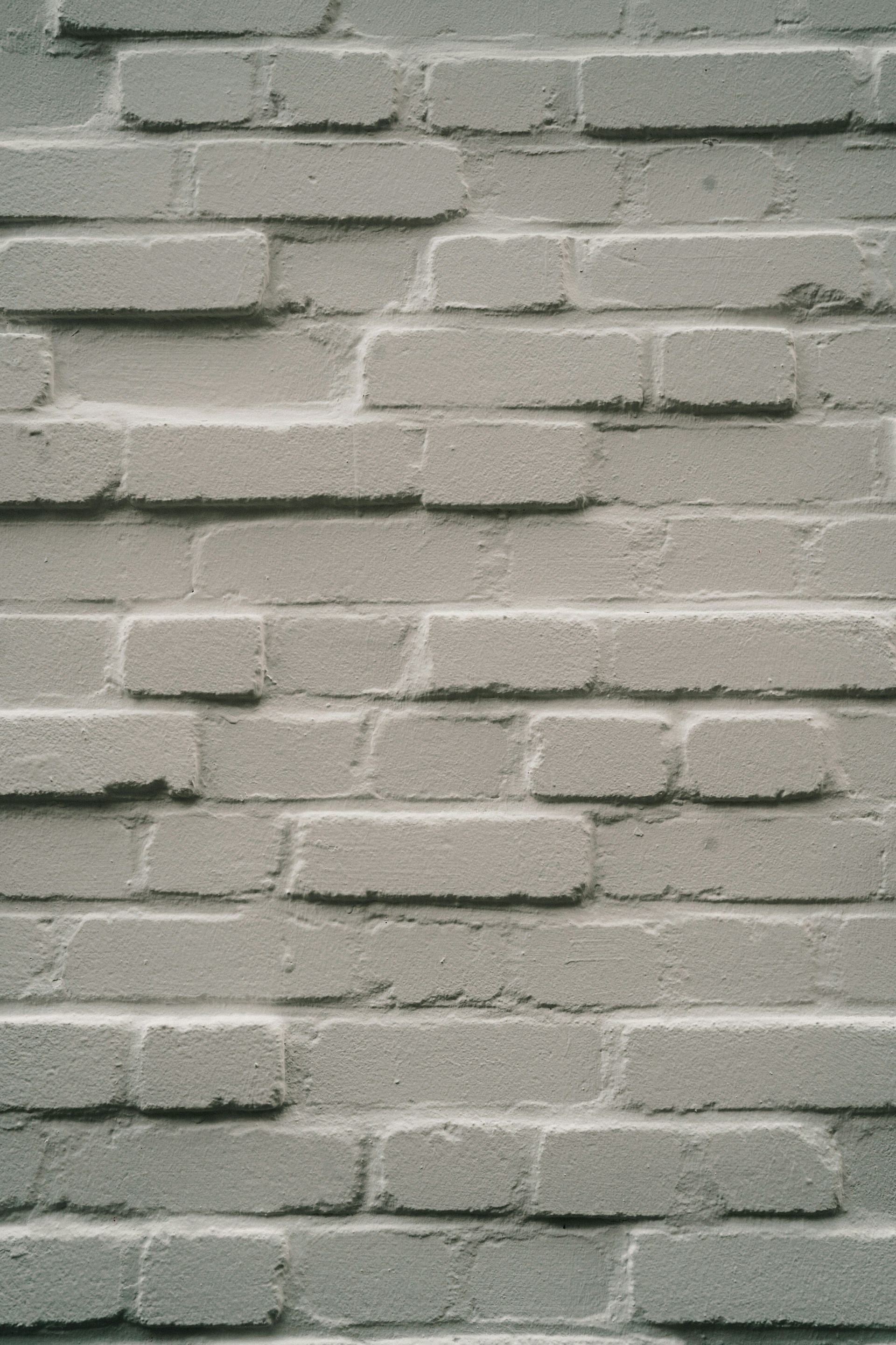 A close up of a white brick wall