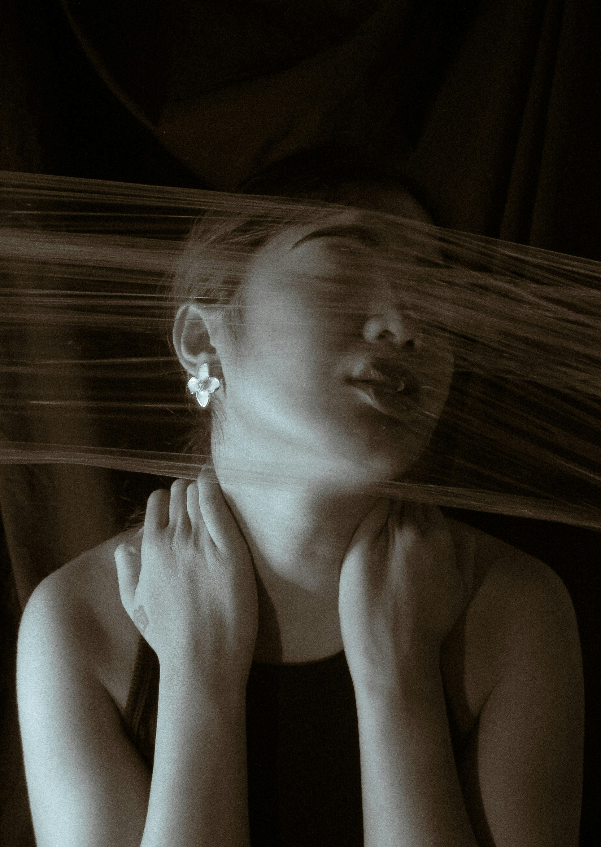 A woman with her hair blowing in the wind