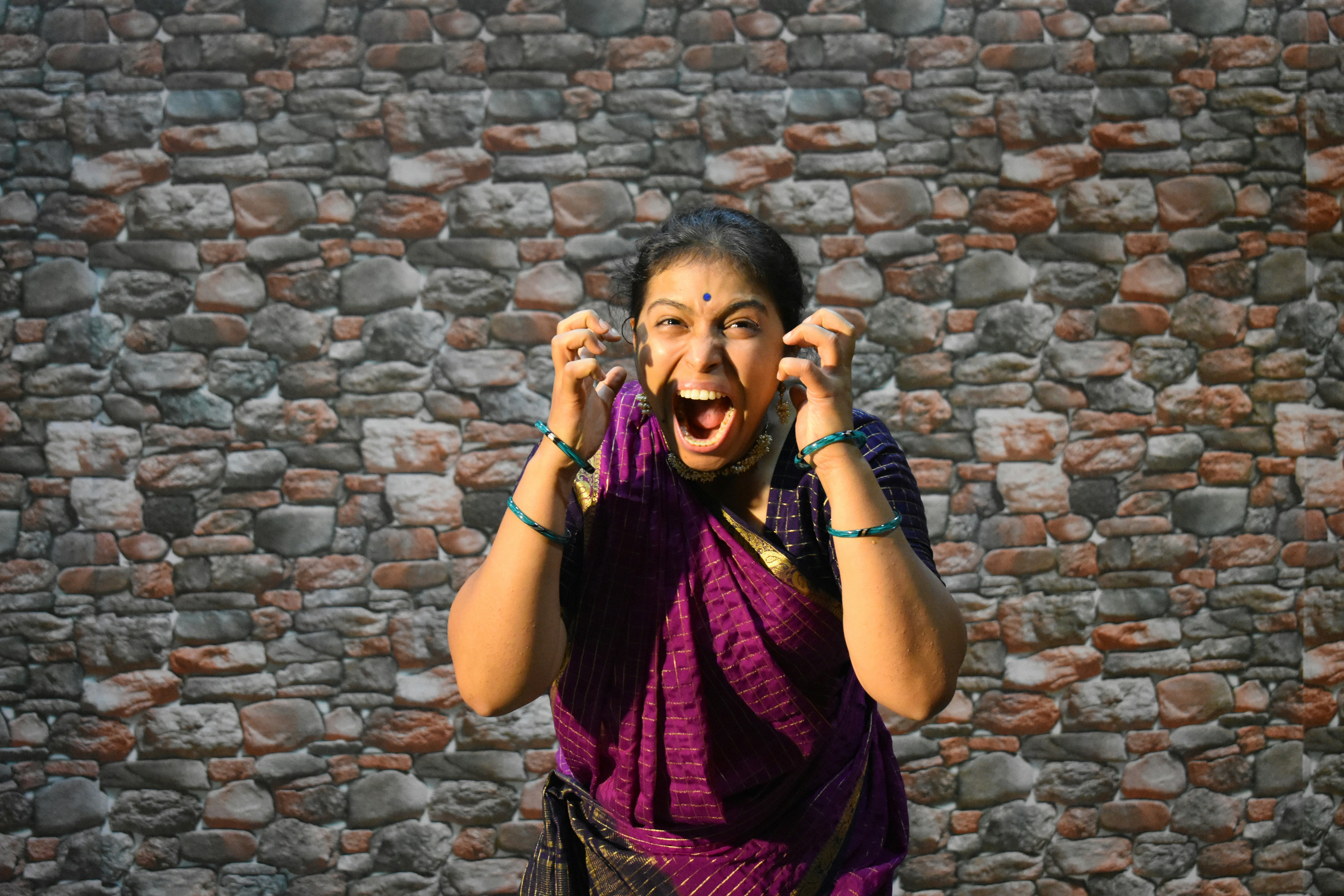 Woman in sari using Tamil voice assistant